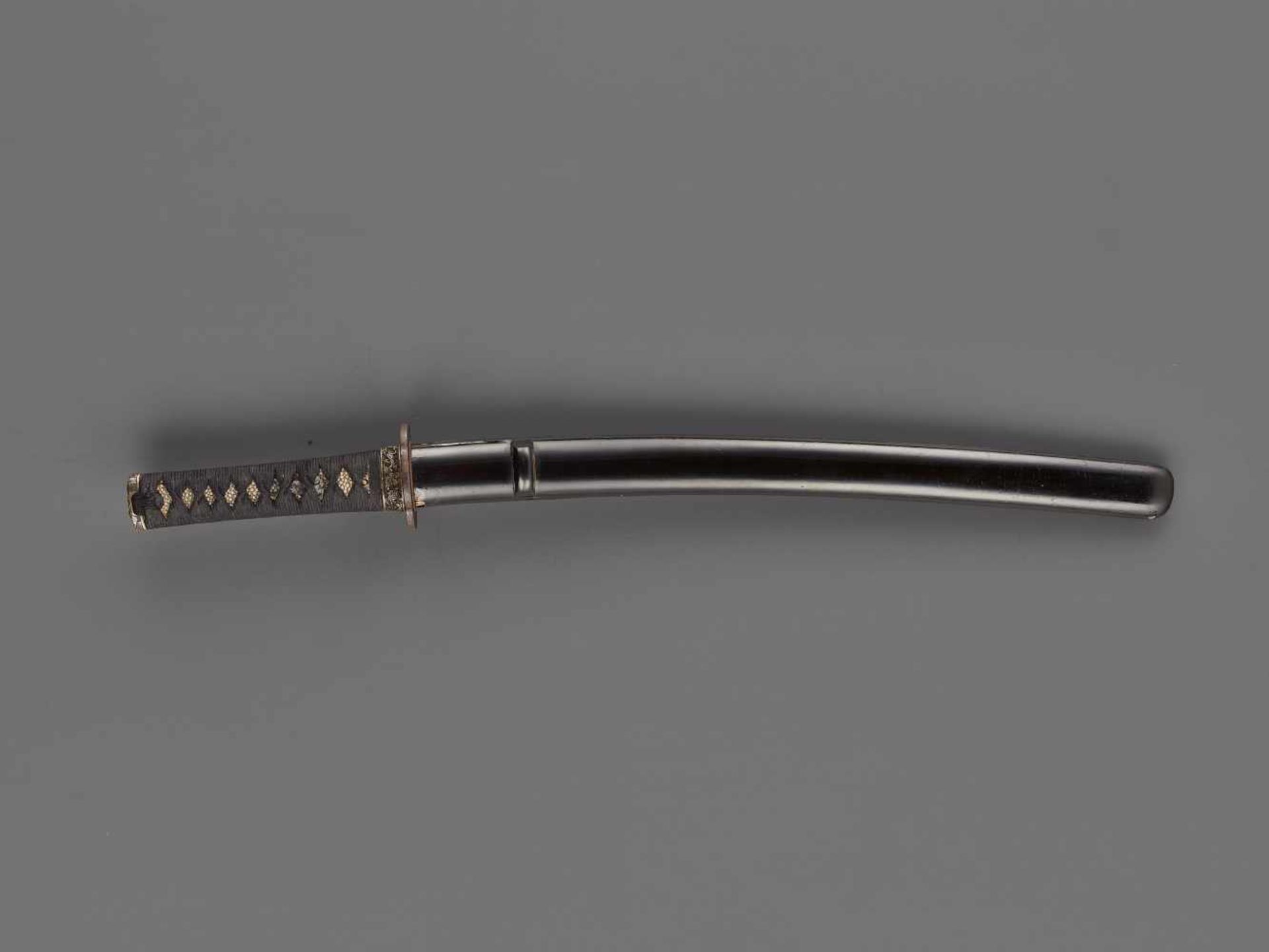 A WAKIZASHI IN KOSHIRAE BY MITSUNAGA Japan, 14th century, Muromachi period (1336-1573)The blade: