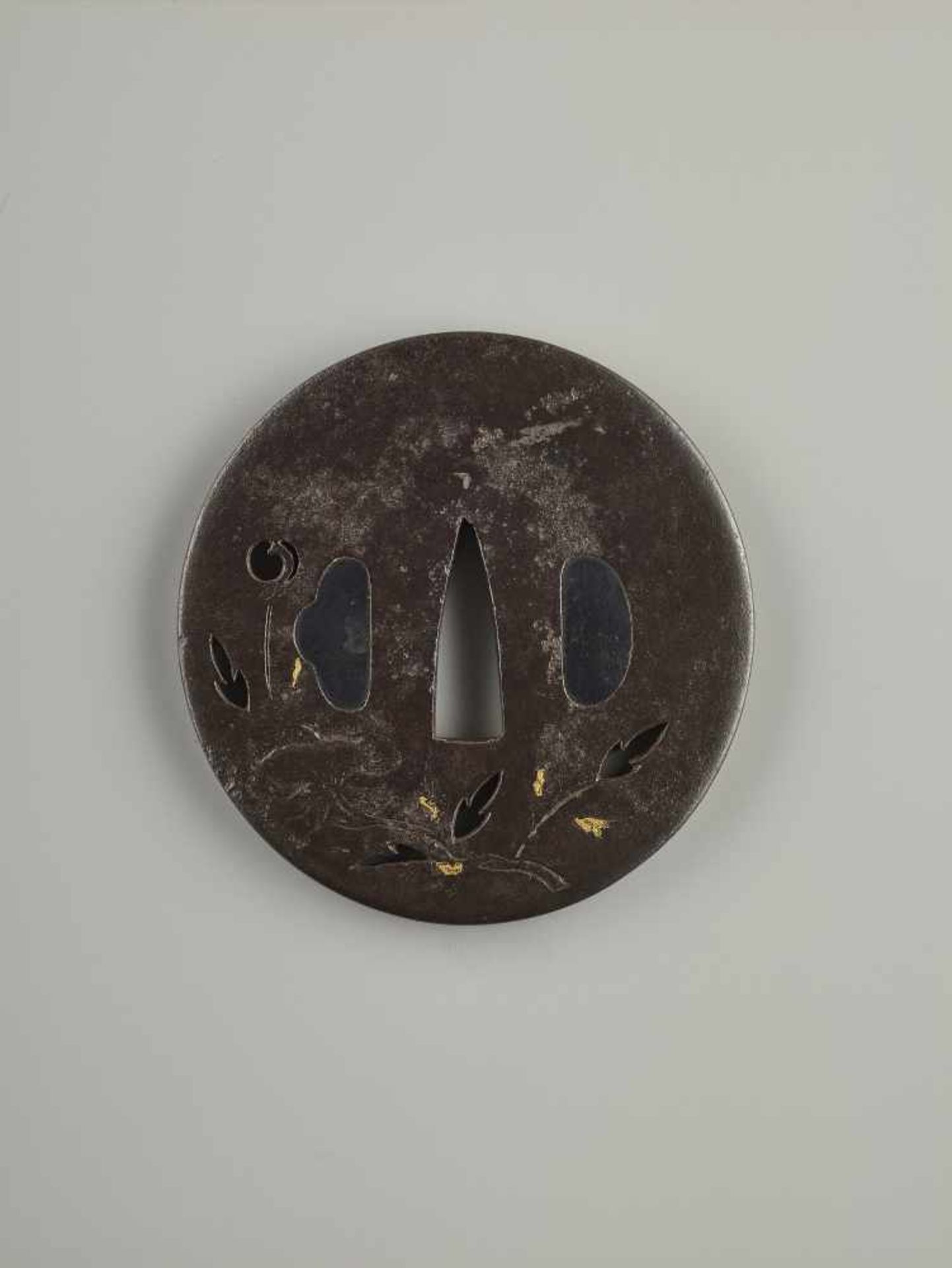 A SIGNED IRON TSUBA WITH LOTUS Signed, iron with goldJapan, Edo period (1615-1868)Of Maru Gata shape - Image 3 of 3