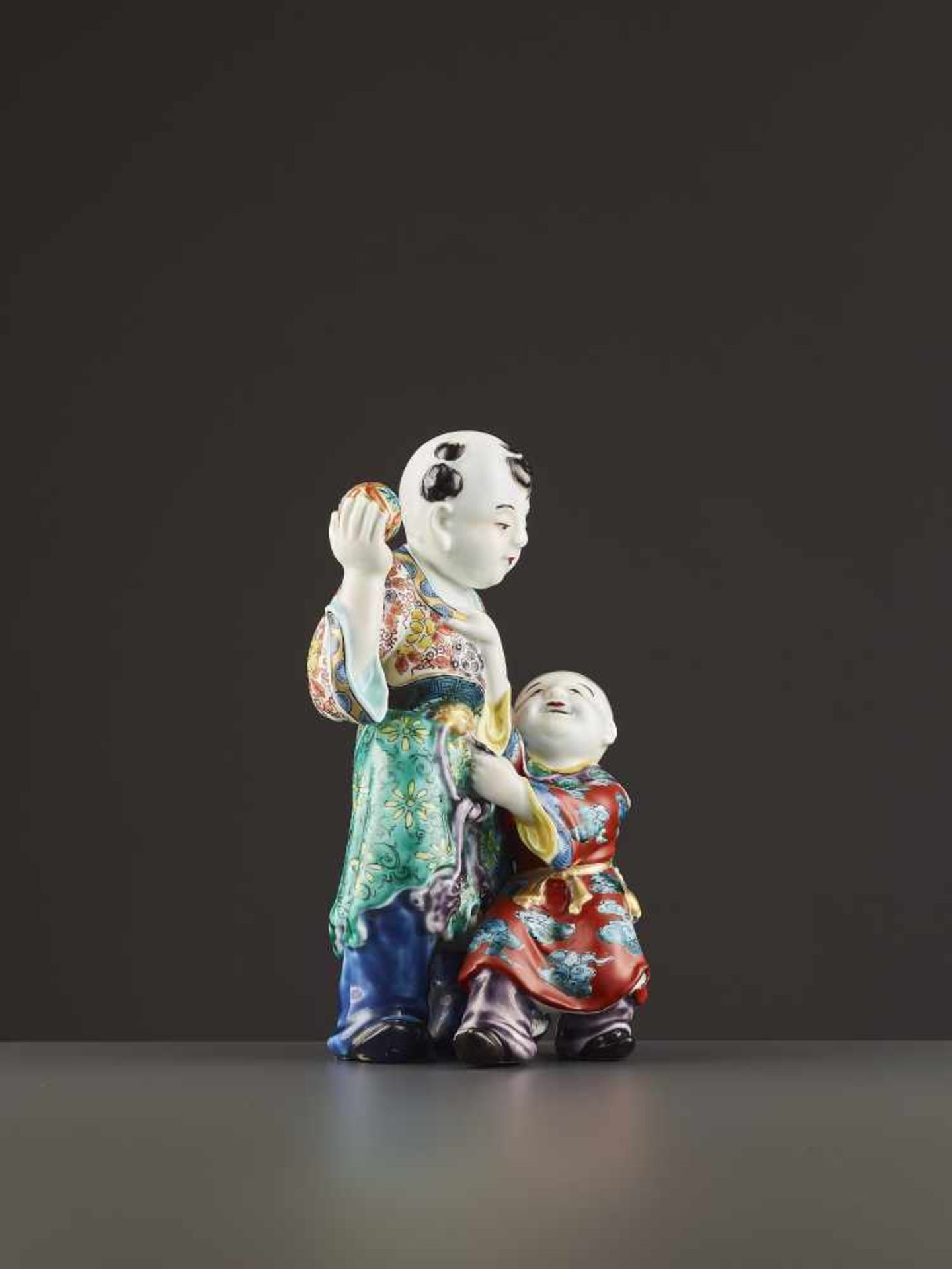 AN ARITA PORCELAIN KARAKO FIGURE Japan, Meiji period (1868-1912). Neatly potted porcelain statue - Image 8 of 9