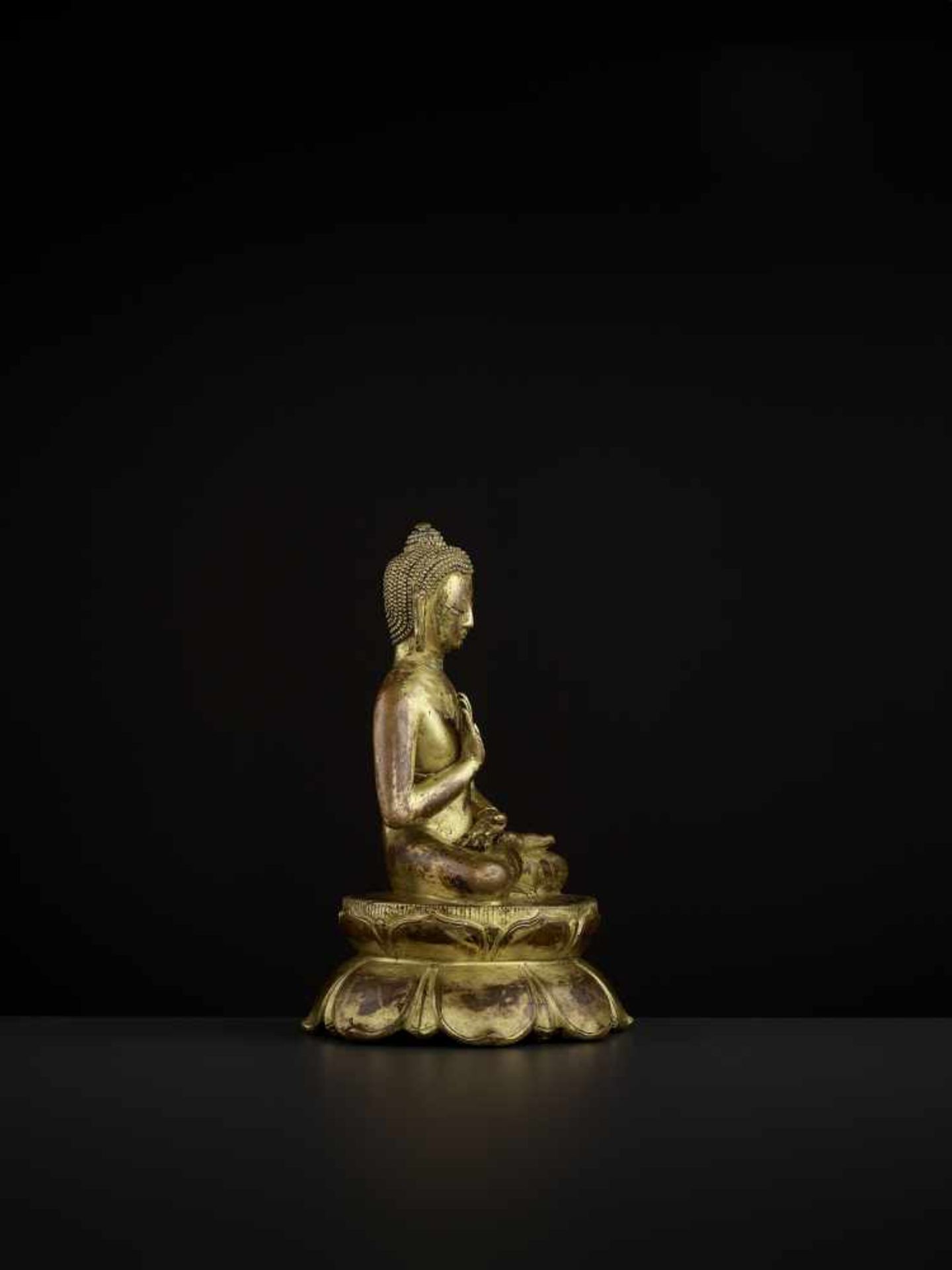 A BUDDHA AMOGHASIDDHI, NEPAL 17TH CENTURY The heavily cast gilt copper-alloy figure is seated in - Image 7 of 14