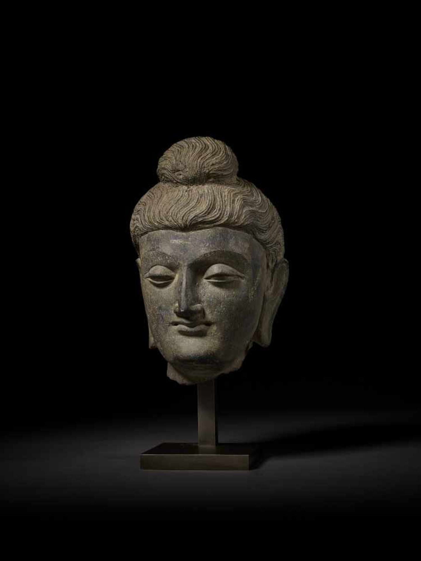 A LARGE HEAD OF BUDDHA, GANDHARA Ancient region of Gandhara, 3rd-4th century. Successfully evoking - Image 3 of 9