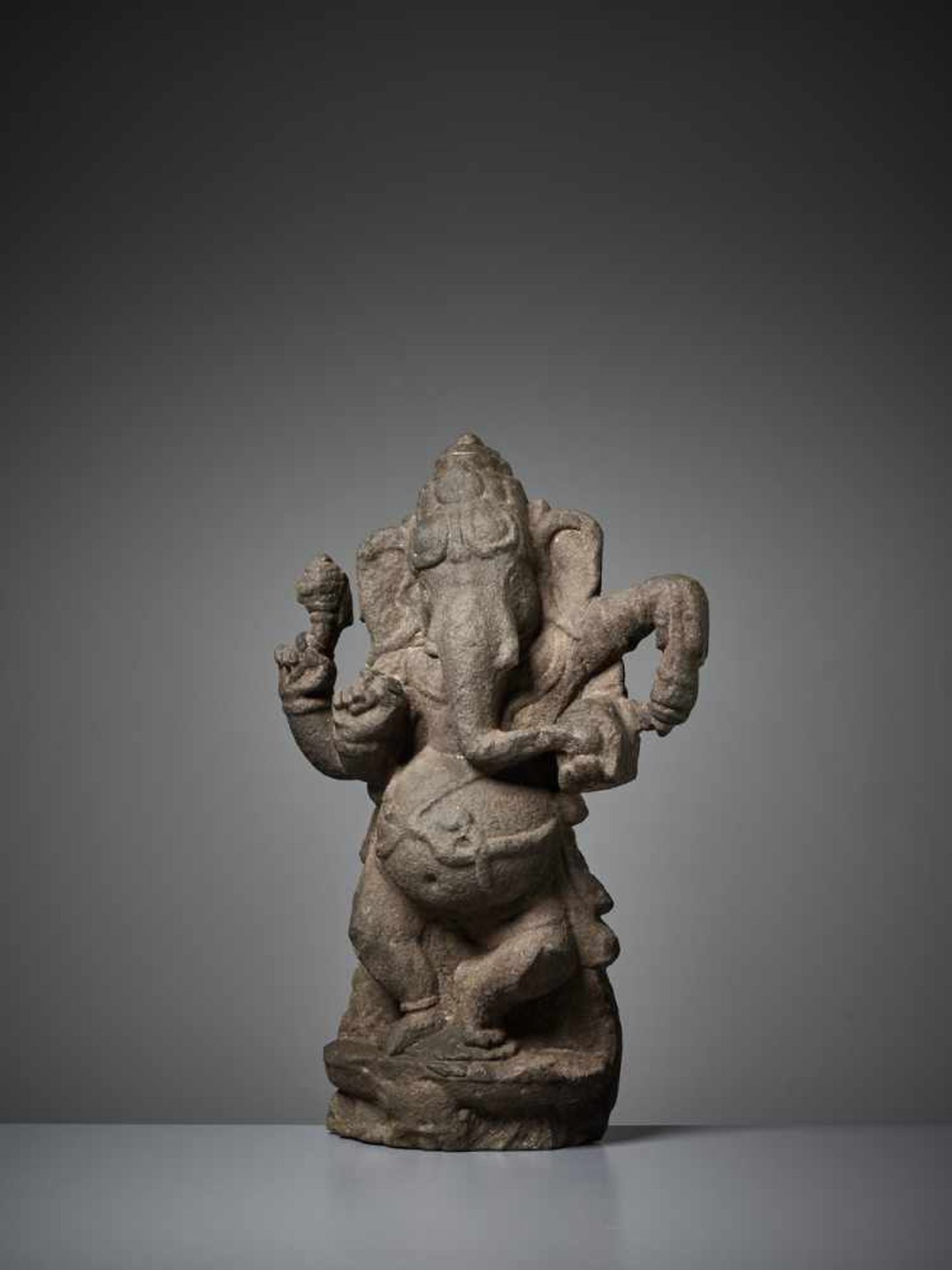 A RARE SANDSTONE STELE OF GANESHA India, 11th – 13th century. Dancing with one leg raised and his - Image 2 of 8