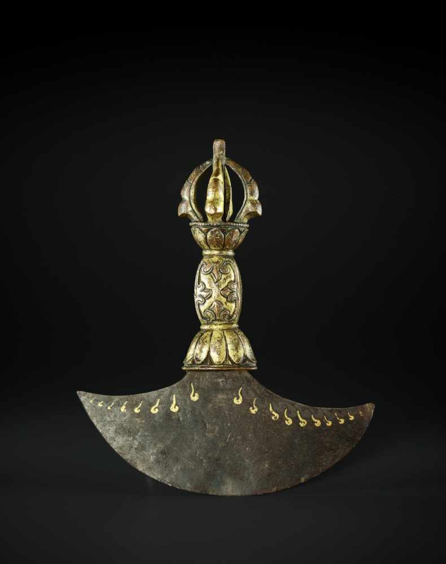 A KARTIKA FLAYING KNIFE, TIBET 17TH CENTURY The crescent-shaped iron blade inlaid in gold with wisps