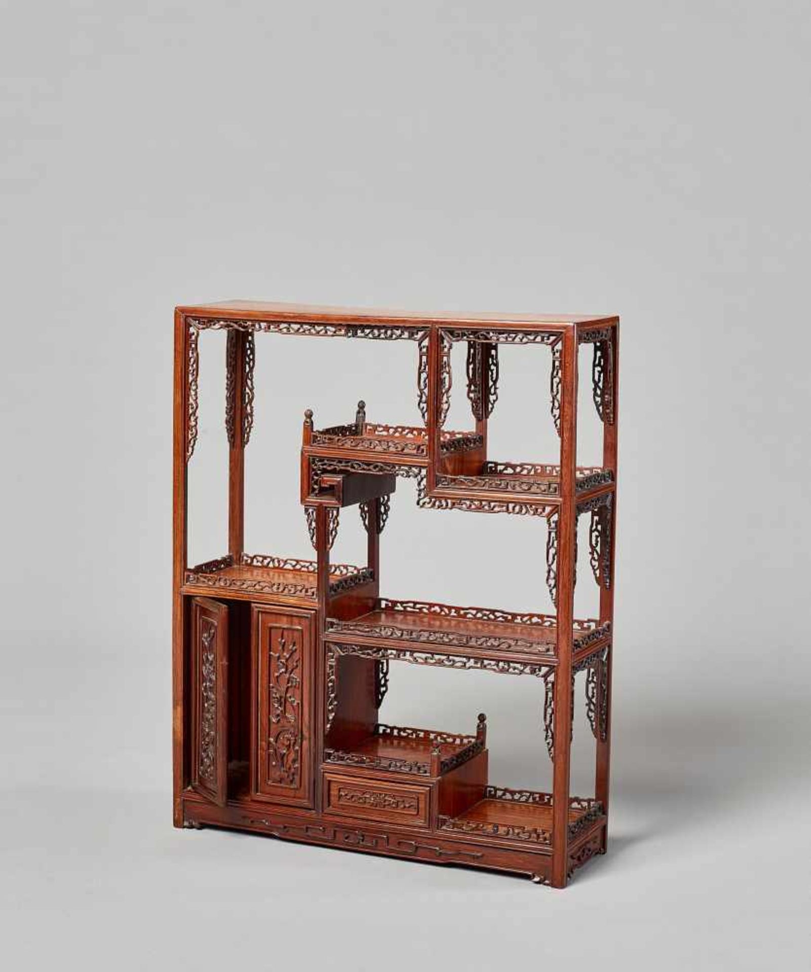 A HARDWOOD DISPLAY TABLE-CABINET, LATE QING DYNASTY China, 19th – earlier 20th century. The wood