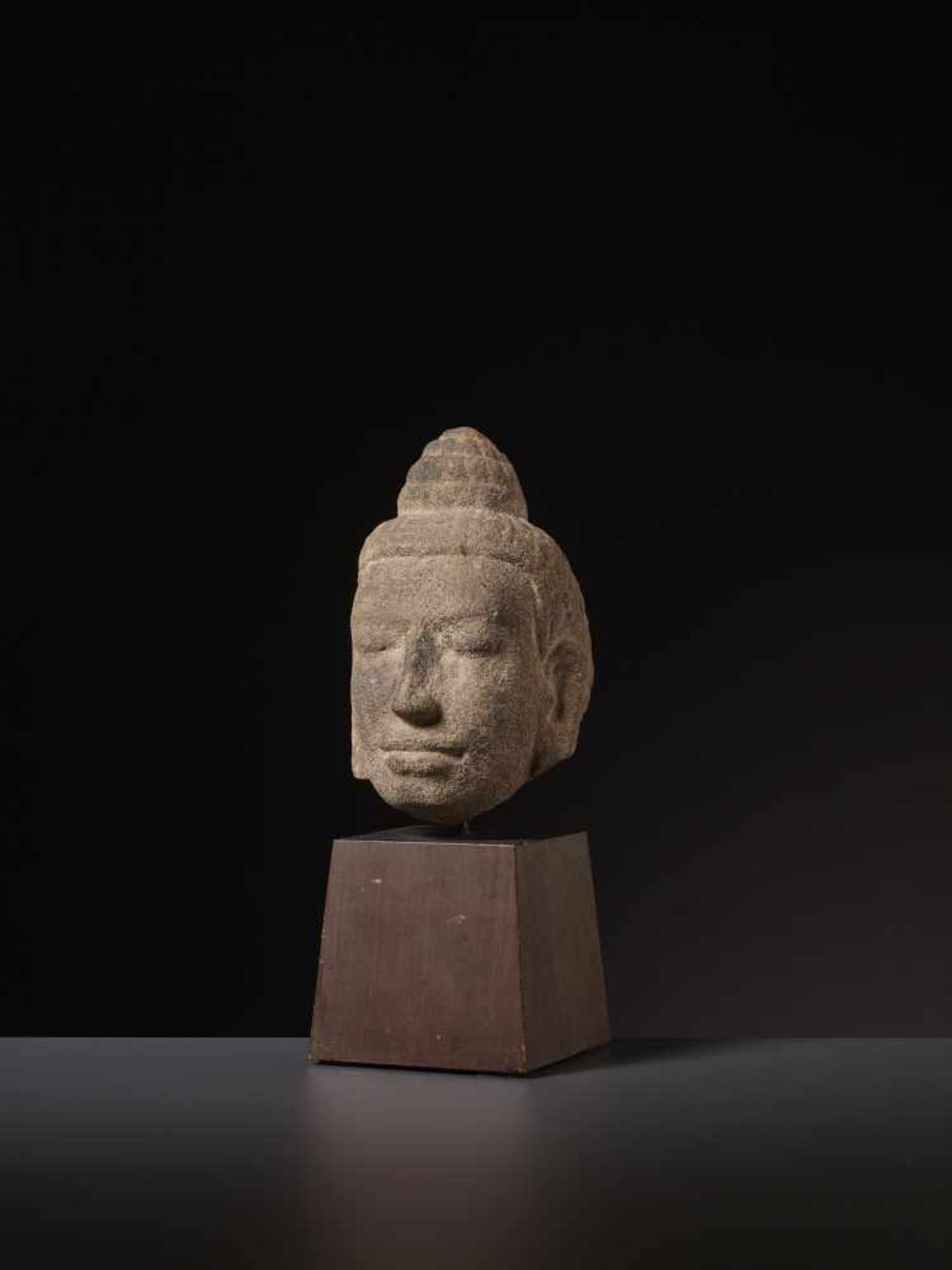 A FINE SANDSTONE HEAD OF BUDDHA, KHMER Cambodia, 11th-12th century. The face with a benevolent - Image 6 of 6