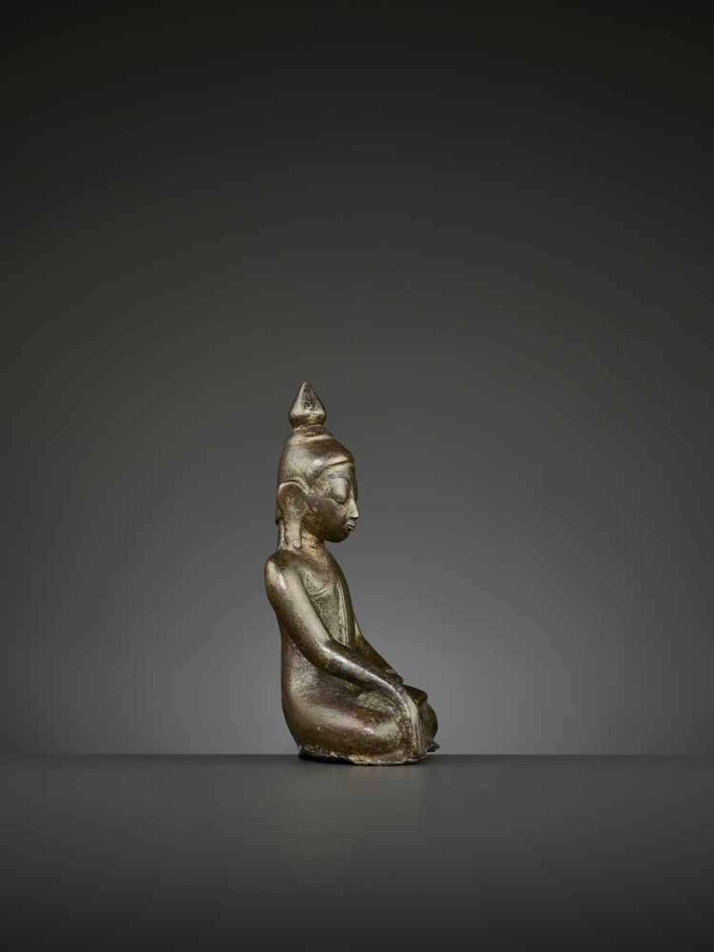 A BUDDHA BRONZE, BURMA, 14TH CENTURY The superbly cast statue depicting Shakyamuni seated in - Image 6 of 8