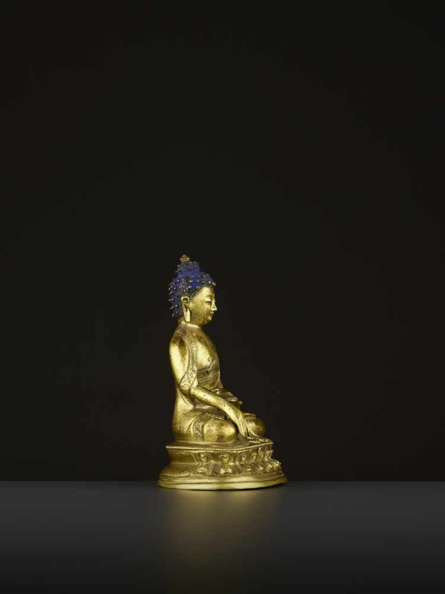 A GILT COPPER-ALLOY BUDDHA, QING China, 18th-19th century. The majestic deity is well cast seated in - Image 6 of 8