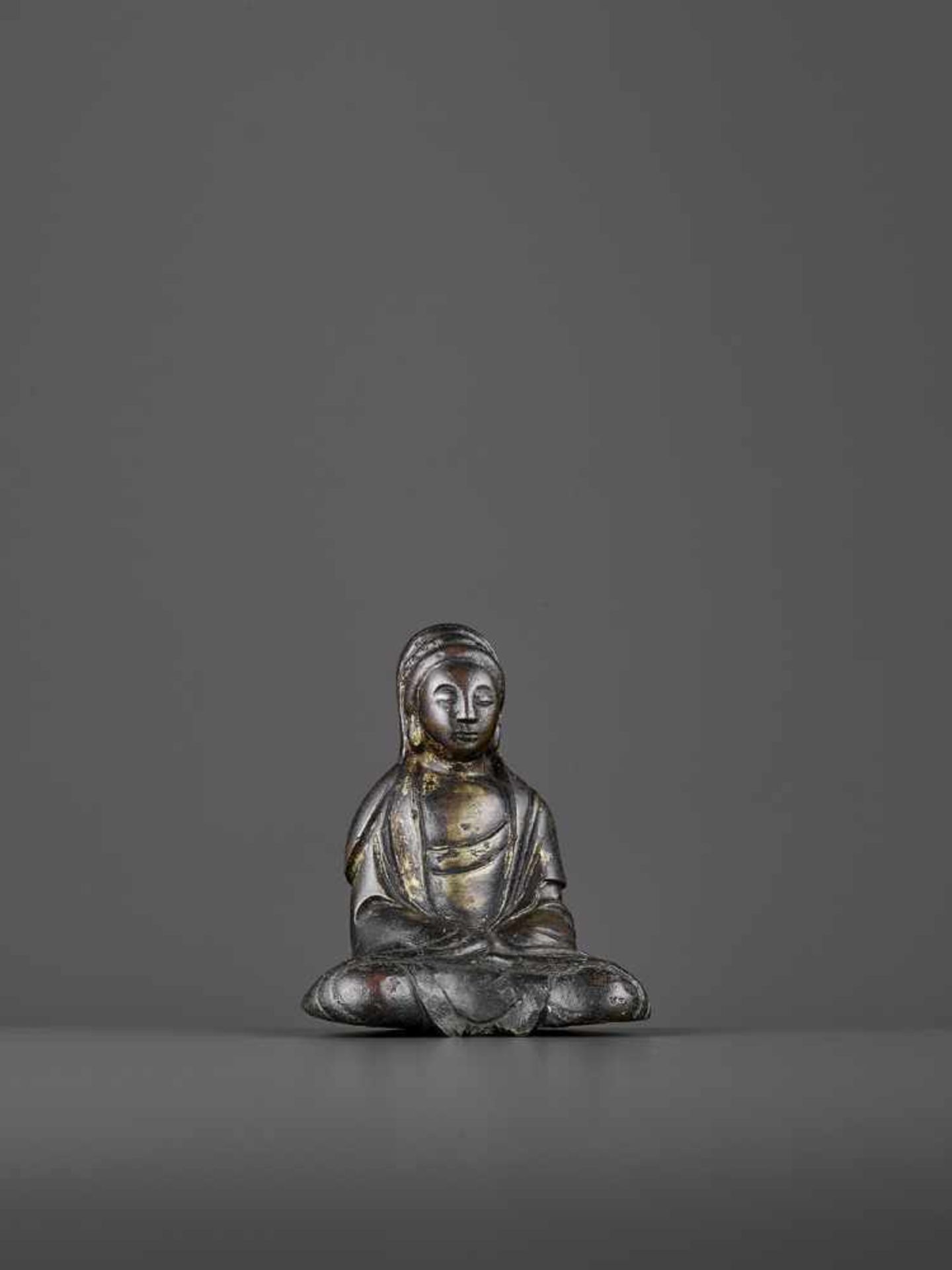 A SMALL BRONZE OF GUANYIN, LIAO DYNASTY China, 916-1125. The heavily cast figure seated in - Image 6 of 8
