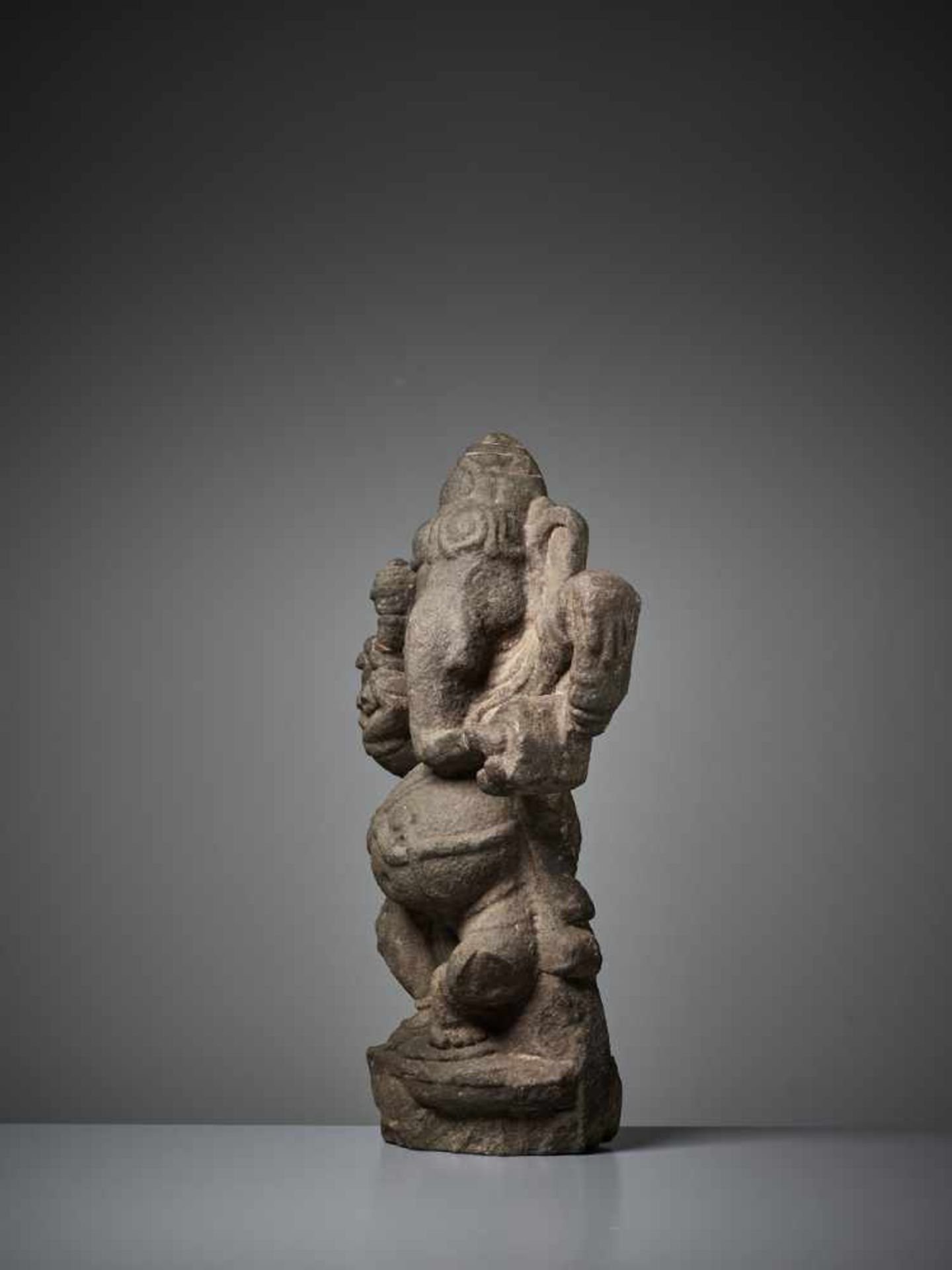 A RARE SANDSTONE STELE OF GANESHA India, 11th – 13th century. Dancing with one leg raised and his - Image 3 of 8