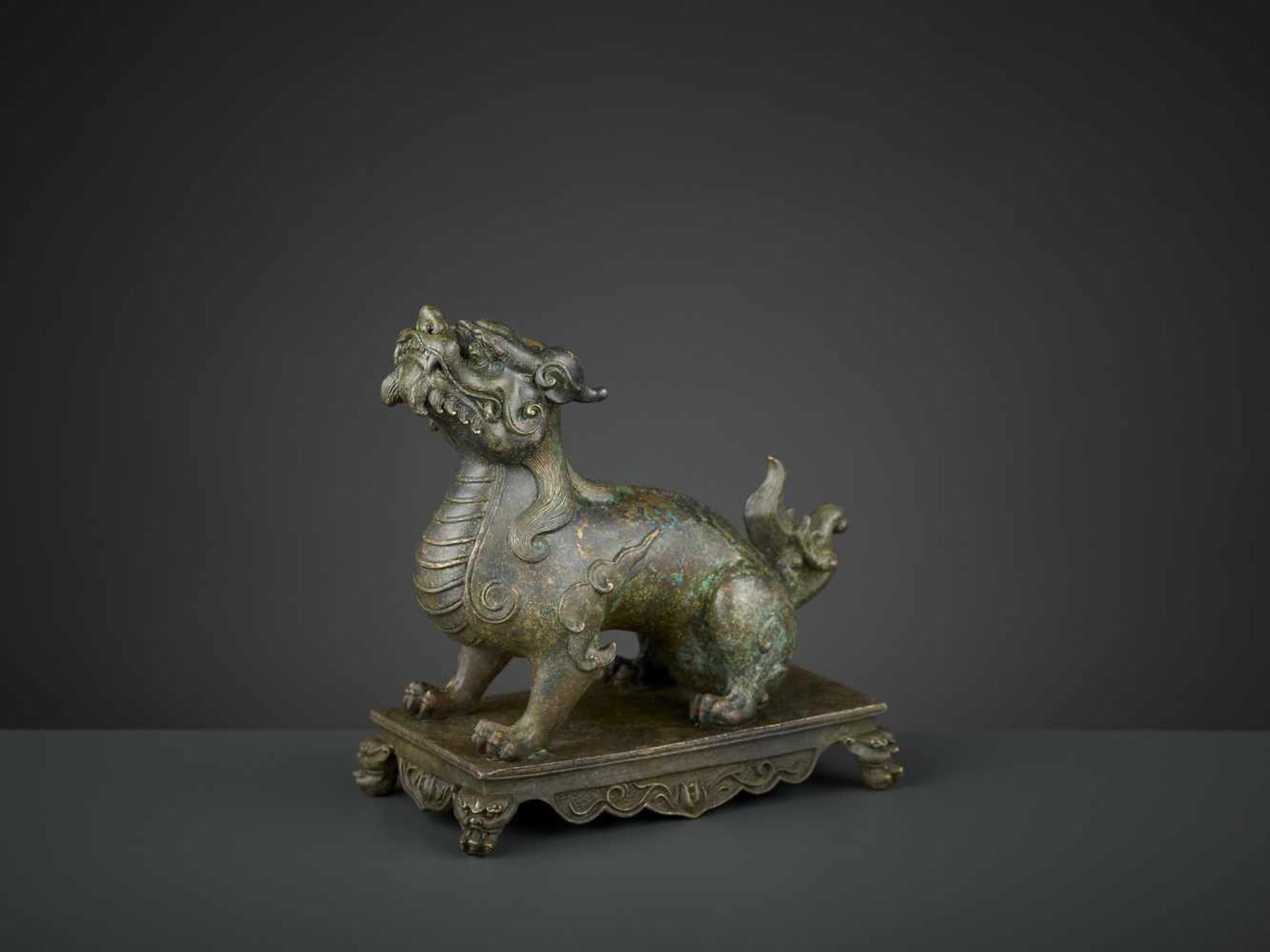 A BRONZE FIGURE OF A QILIN, QIANLONG SIX-CHARACTER MARK AND OF THE PERIOD China, 1736-1795. The