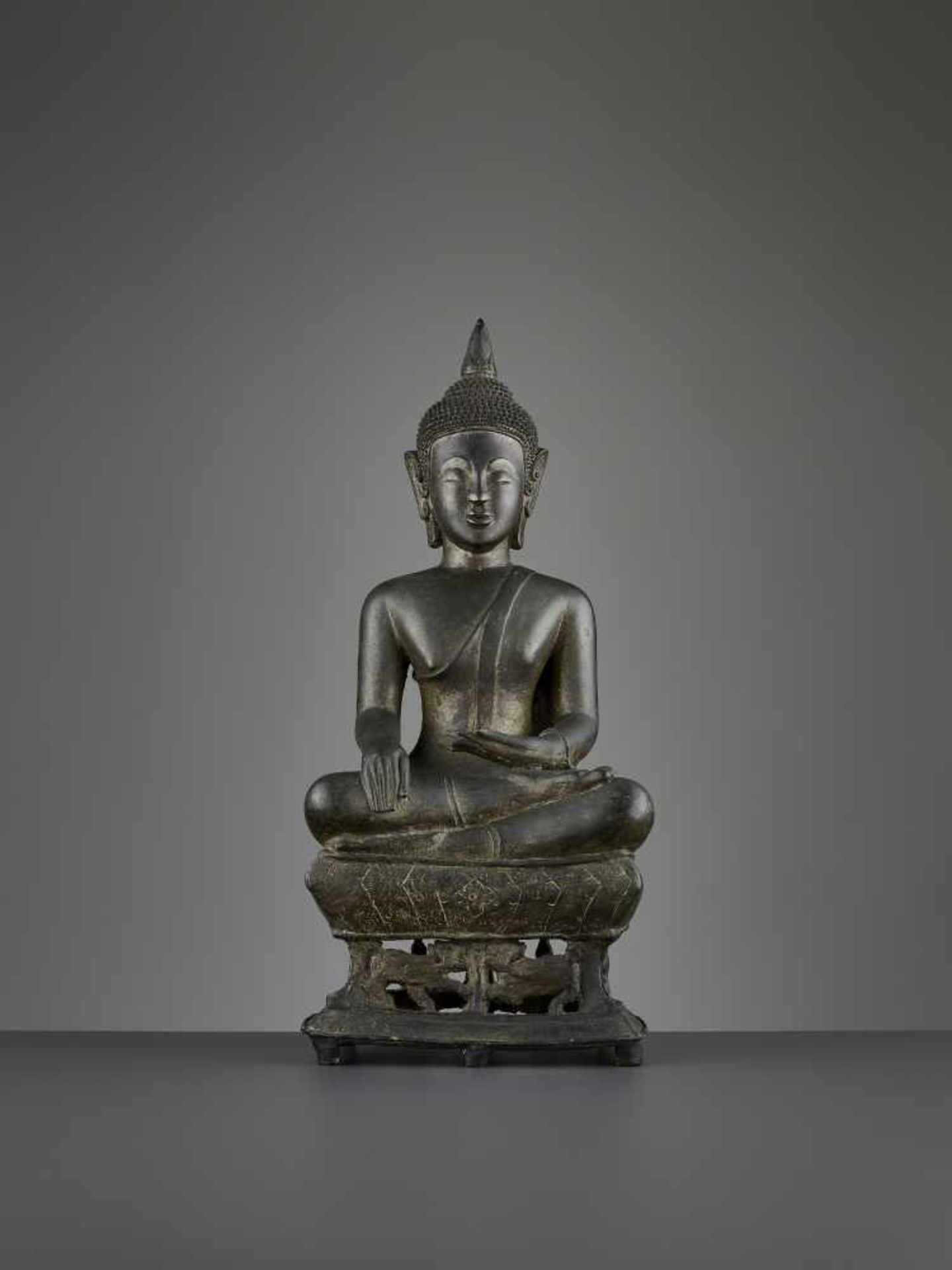 A BUDDHA SHAKYAMUNI BRONZE, LAOS Laos or Northern Thailand, 17th century. The massively cast