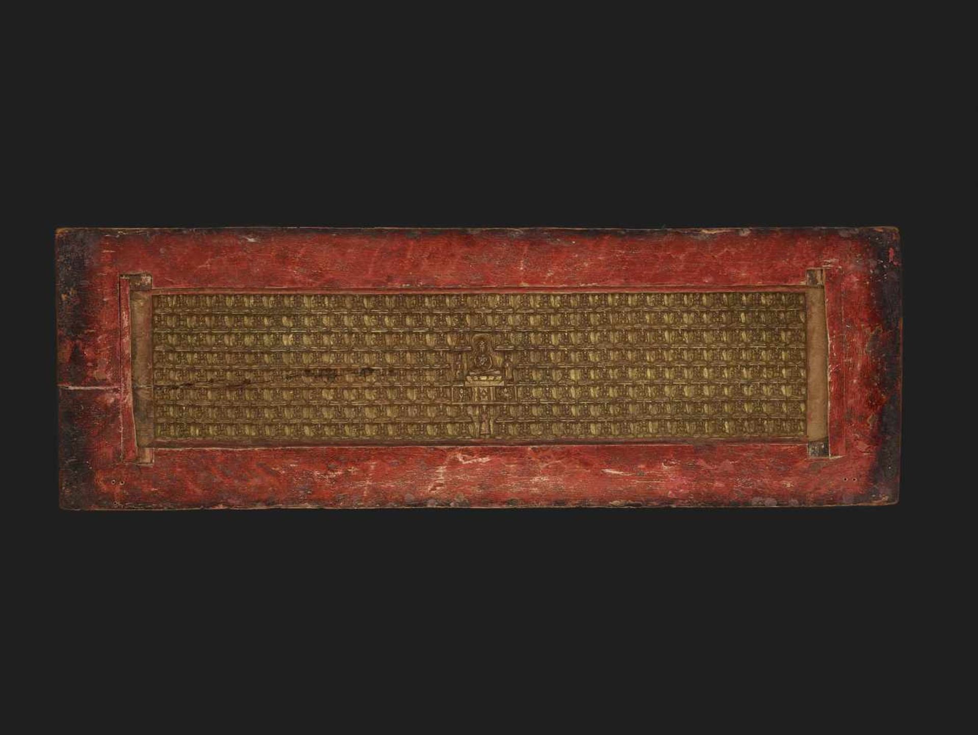 A RARE ‘108 BUDDHA’ MANUSCRIPT COVER Tibet, 17th - earlier 18th century.The gilded upper