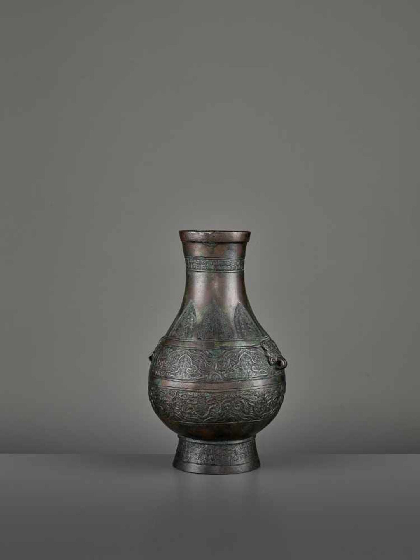 A BRONZE RITUAL VASE, HU China, Ming dynasty (1368-1644) or earlier. The archaistic vessel is cast - Image 3 of 11