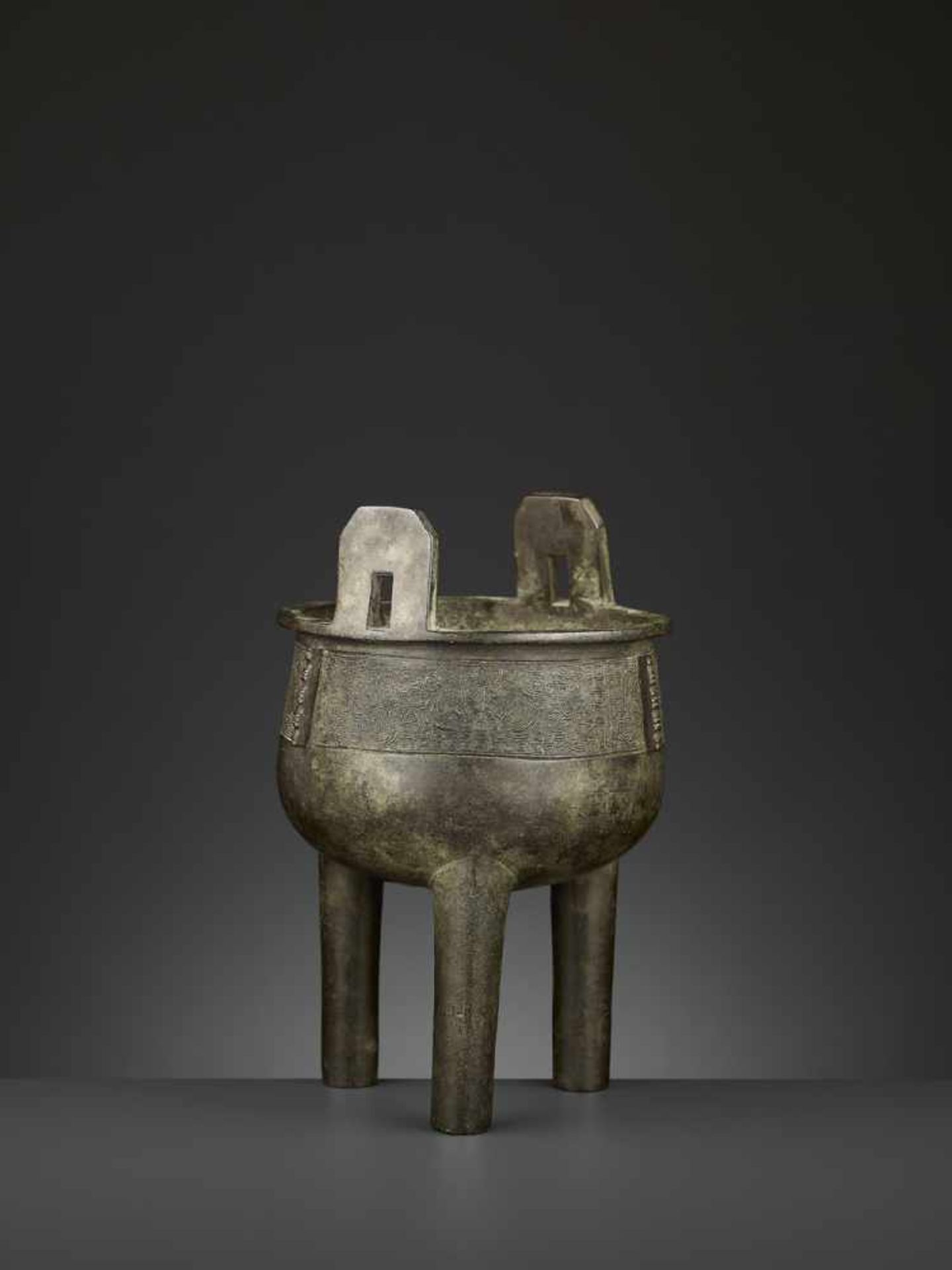 AN ARCHAISTIC BRONZE CENSER, DING China, 17th-18th century. The deep, bowl-shaped body supported - Image 4 of 10