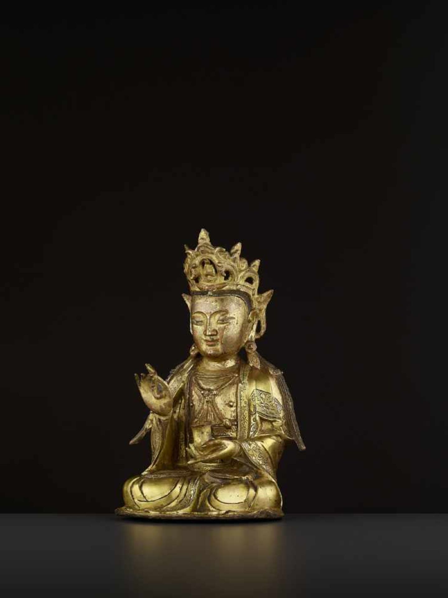 A FINELY CAST GILT-BRONZE FIGURE OF GUANYIN, MING DYNASTY China, 16th-17th century. The figure is