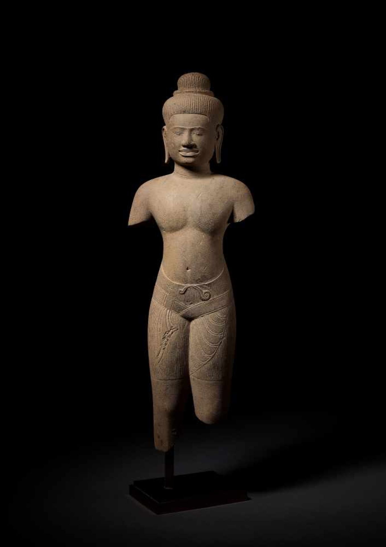 A STANDING DEITY, BAPHUON, KHMER, 11TH CENTURY A finely polished and exquisitely carved sandstone