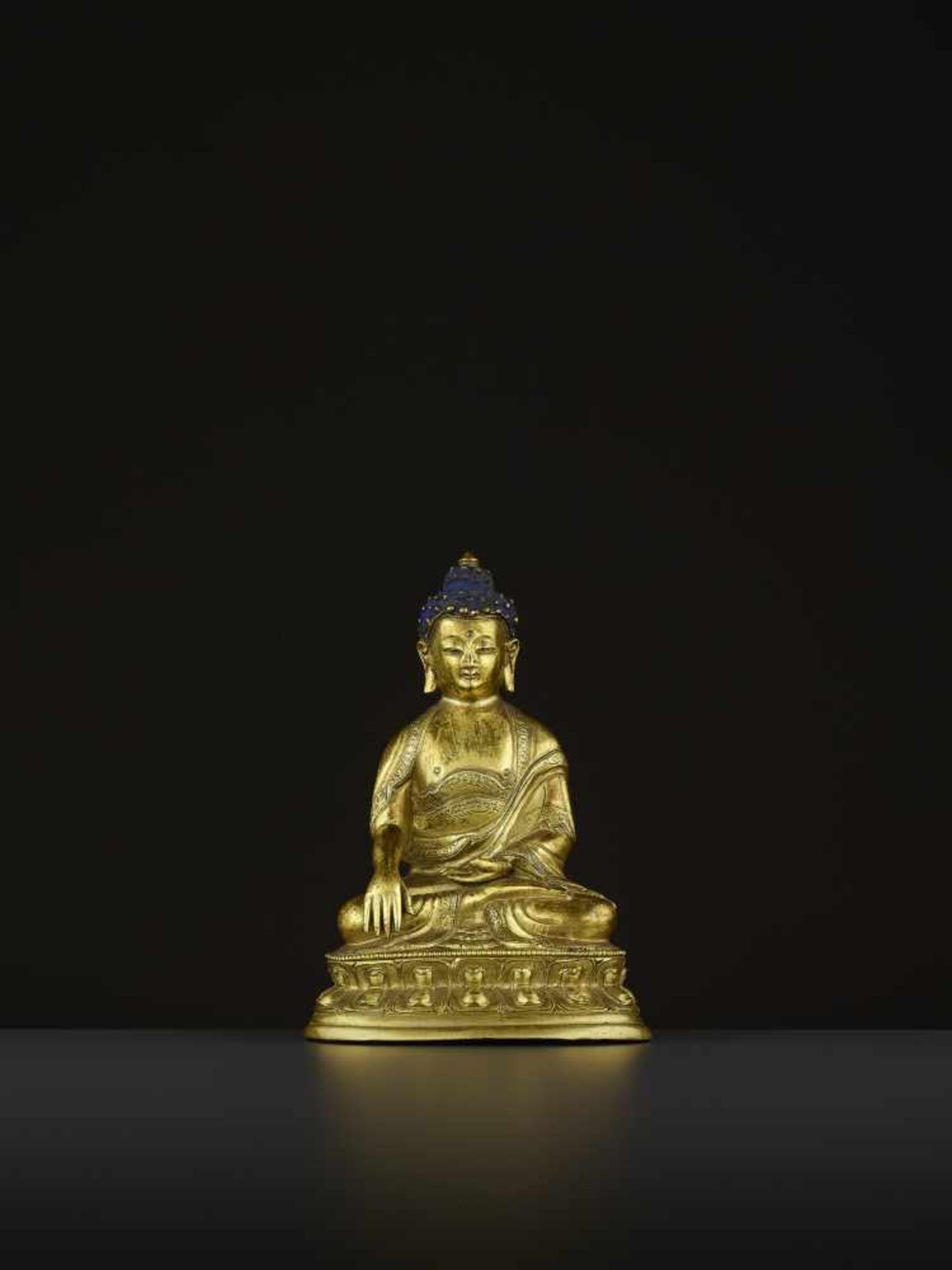 A GILT COPPER-ALLOY BUDDHA, QING China, 18th-19th century. The majestic deity is well cast seated in