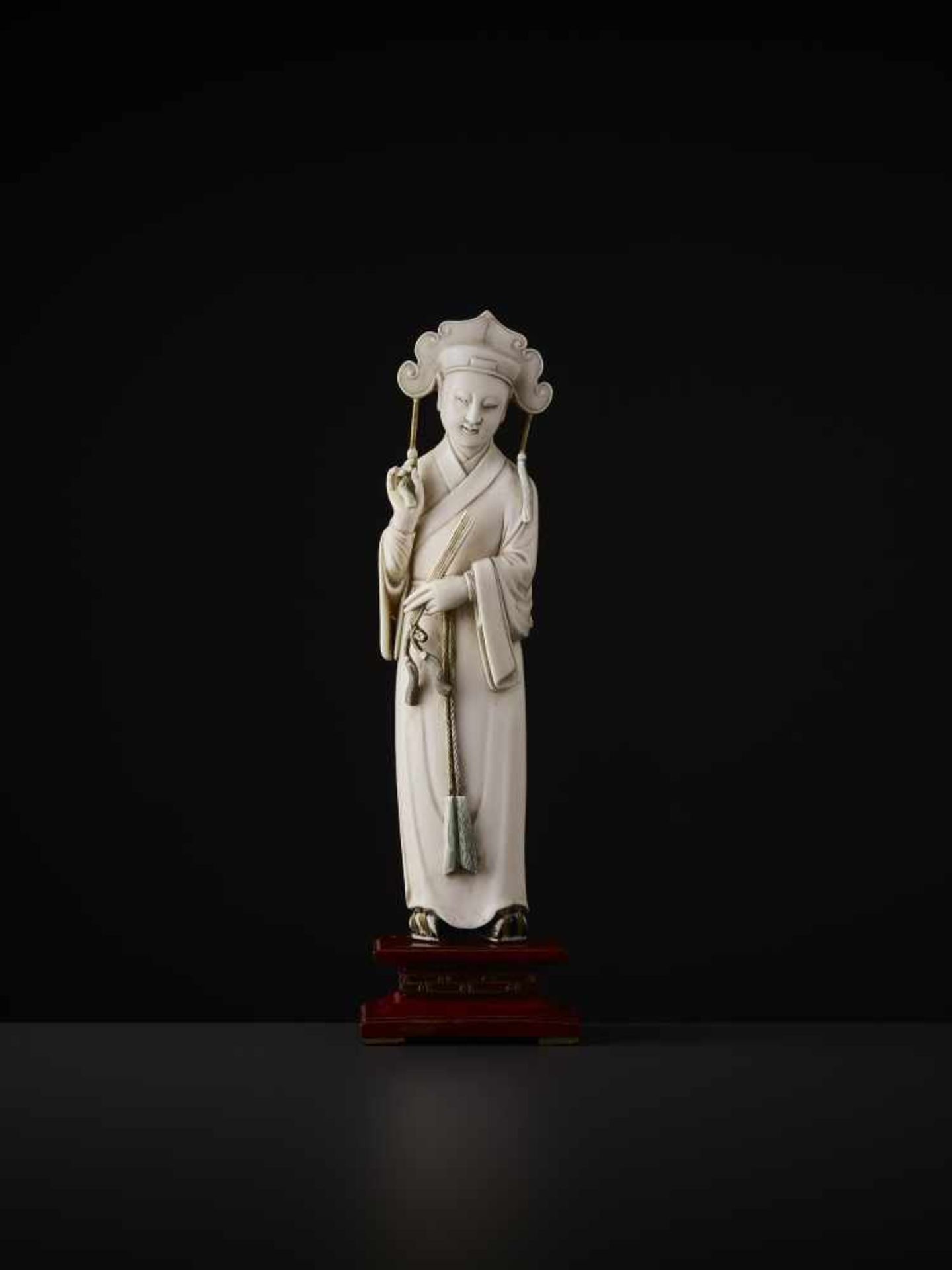 A MANCHU COURTIER IVORY FIGURE, QING China, 19th century. Openwork carving from a single piece of