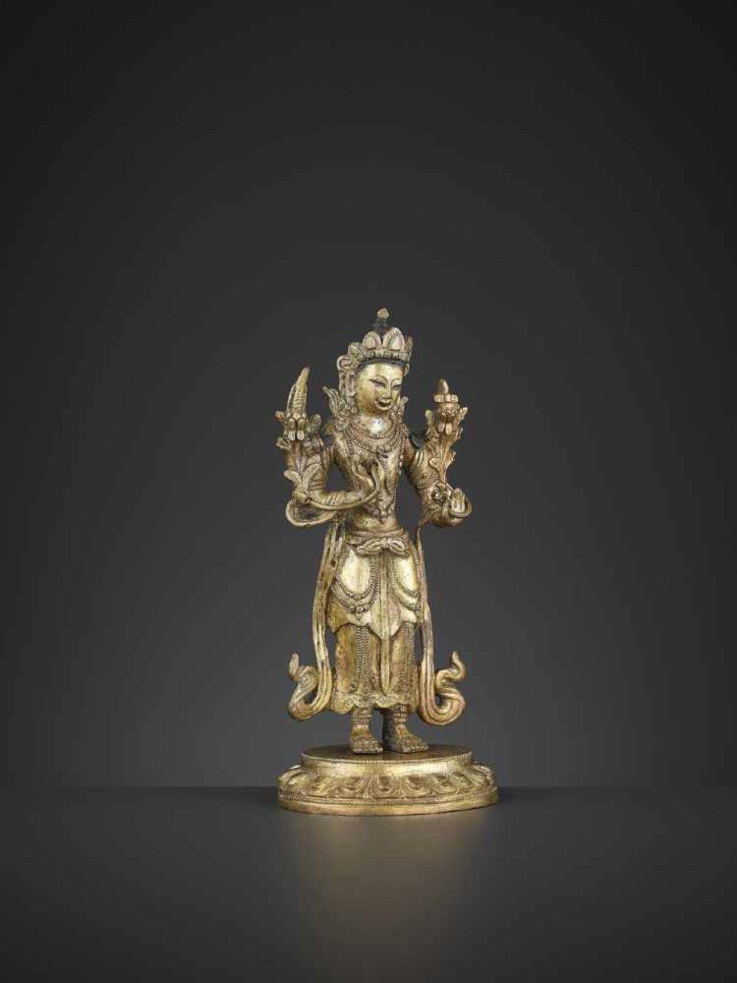 A GILT-BRONZE STANDING MANJUSHRI, QIANLONG China, 1736-1795. The proper right hand raised in vitarka - Image 6 of 10