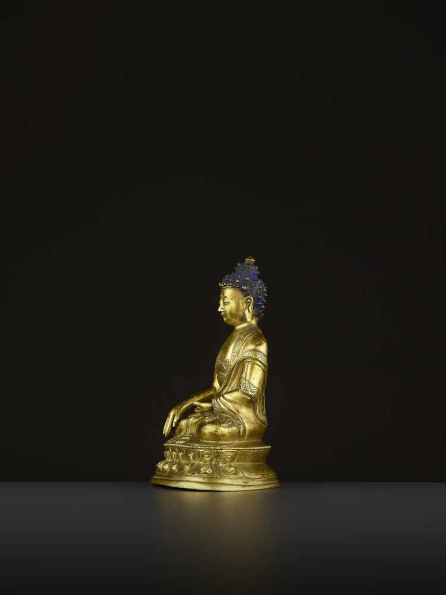 A GILT COPPER-ALLOY BUDDHA, QING China, 18th-19th century. The majestic deity is well cast seated in - Image 4 of 8