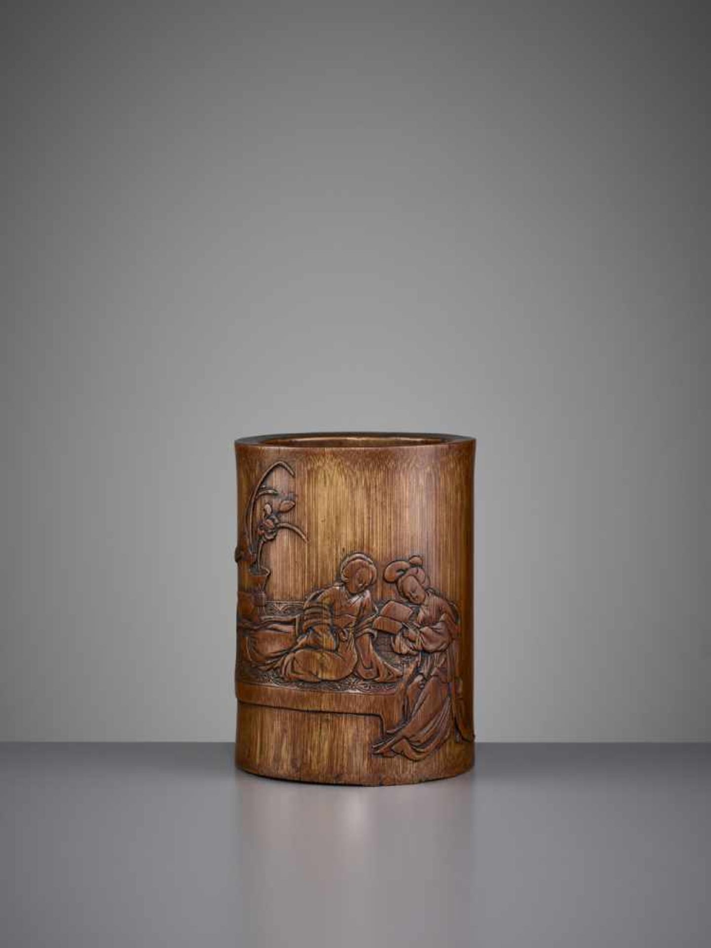 A BAMBOO BRUSHPOT 17TH/18TH CENTURY China. Of cylindrical form, the exterior well carved in