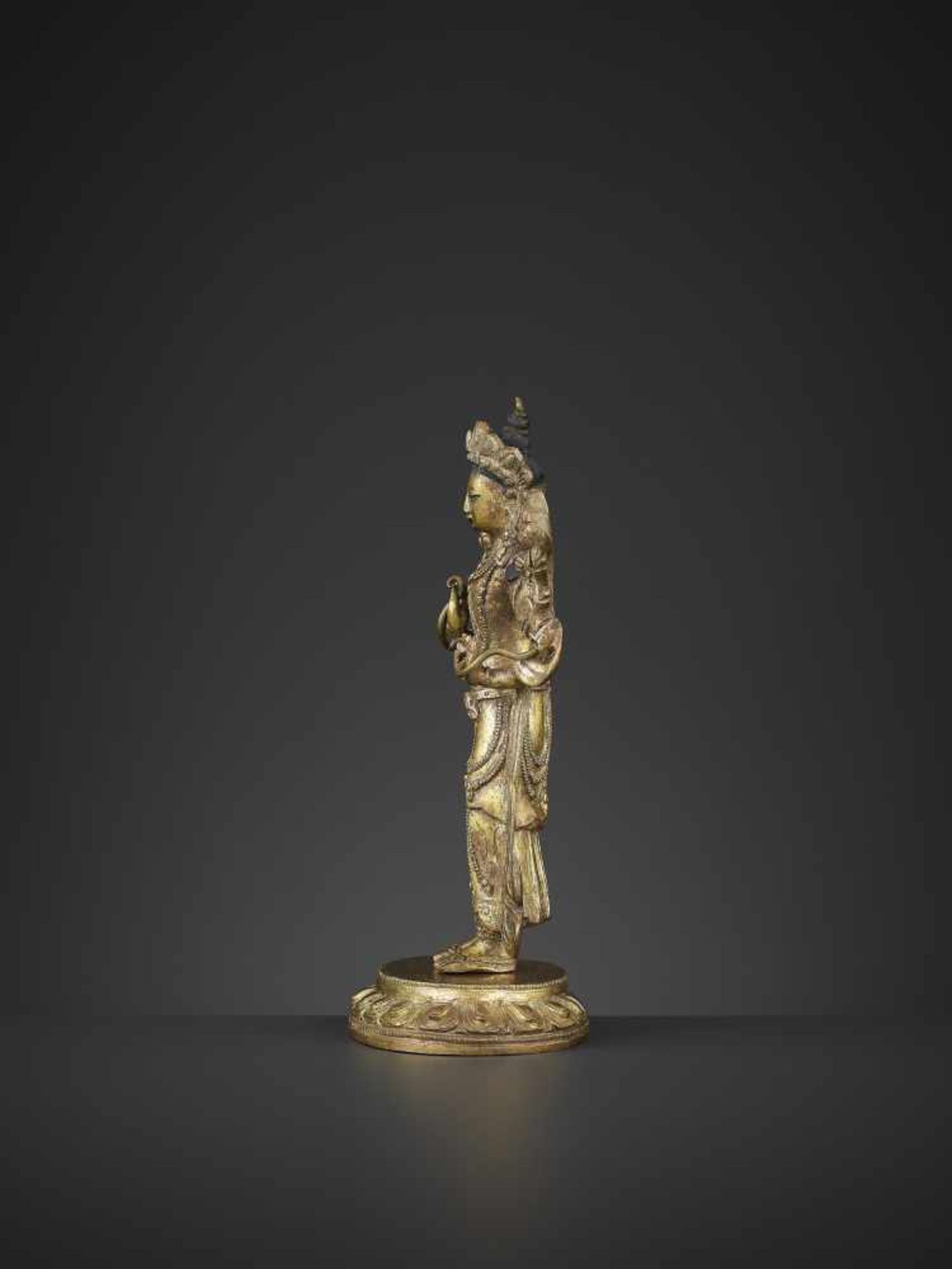 A GILT-BRONZE STANDING MANJUSHRI, QIANLONG China, 1736-1795. The proper right hand raised in vitarka - Image 3 of 10