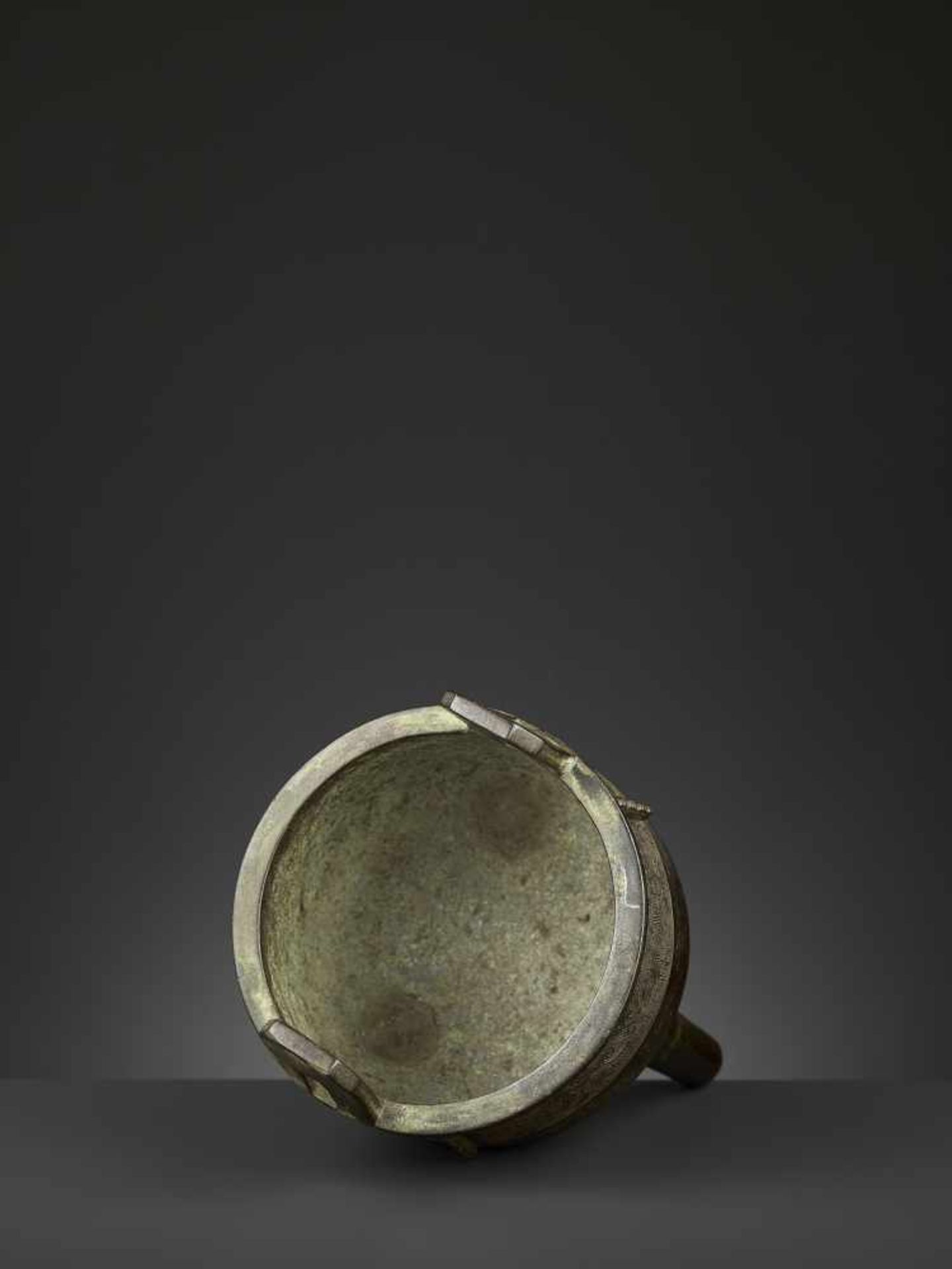 AN ARCHAISTIC BRONZE CENSER, DING China, 17th-18th century. The deep, bowl-shaped body supported - Image 6 of 10