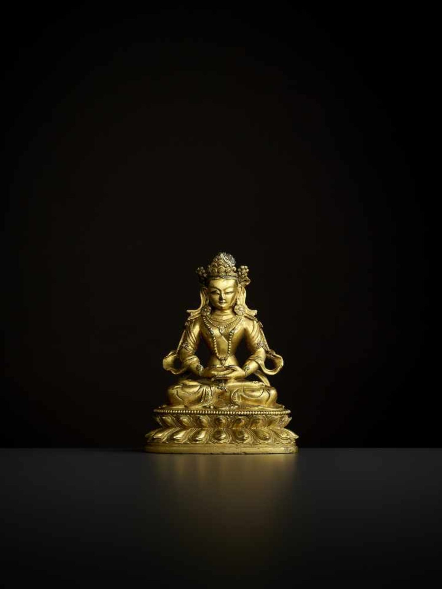 A GILT-BRONZE AMITAYUS, 18TH CENTURY China. Finely and heavily cast seated in dhyanasana on a