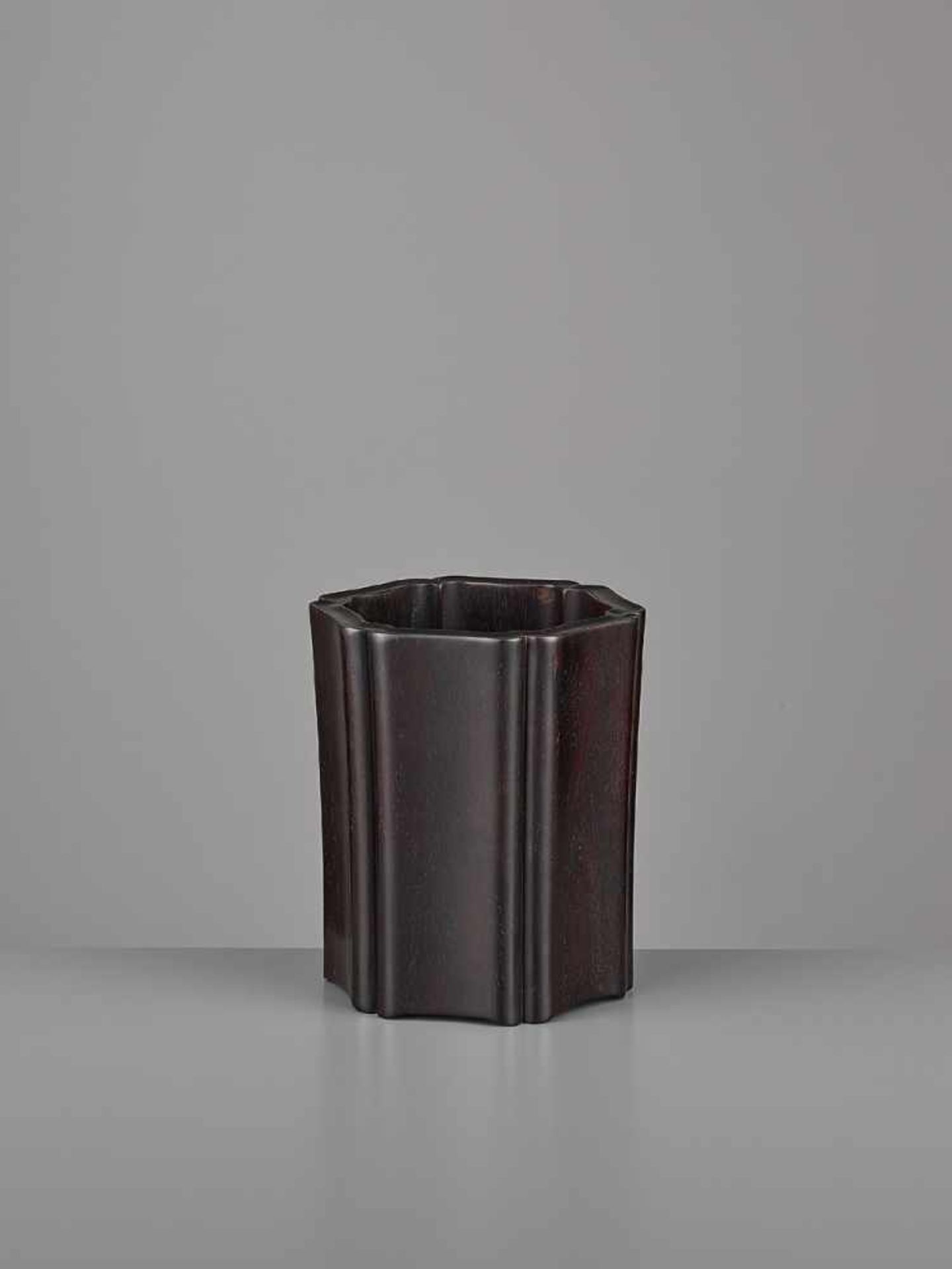 A LOBED ZITAN BRUSHPOT, BITONG China, Qing dynasty. Of slender cylindrical form, the deftly carved