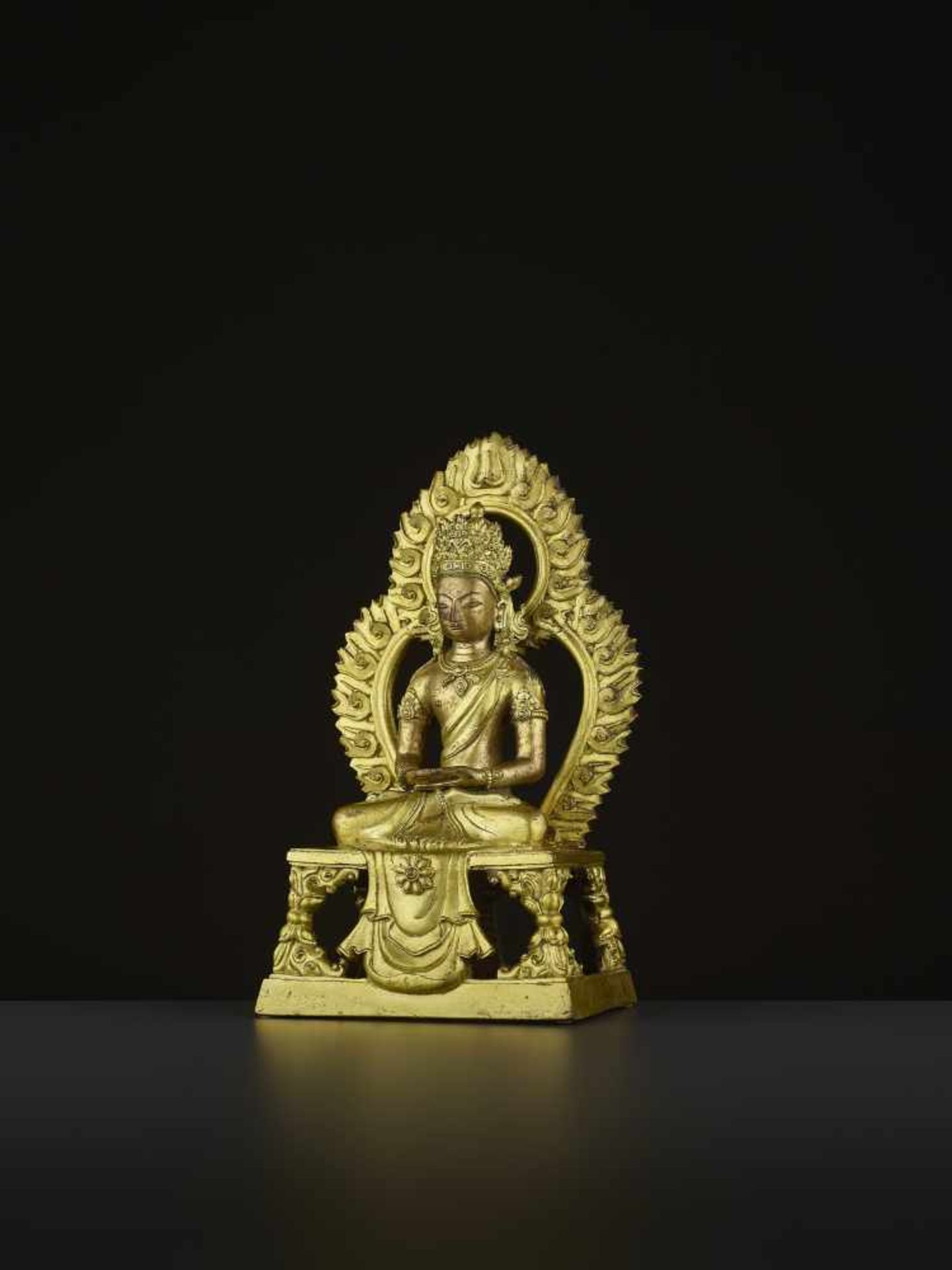 A GILT-BRONZE FIGURE OF AMITAYUS, QIANLONG China, 1736-1795. The figure is finely cast with legs