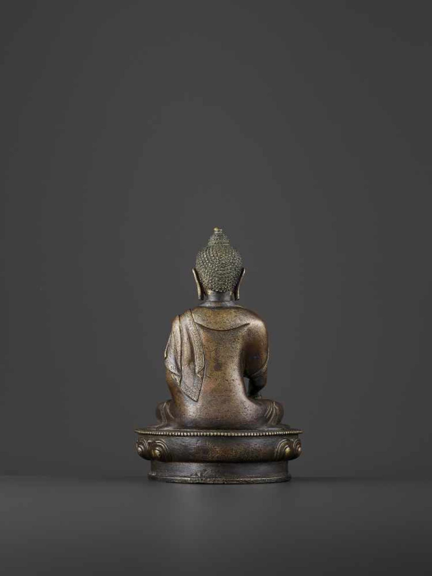 A BRONZE BUDDHA SHAKYMUNI, QING China, 18th century. The figure seated on a beaded lotus base in - Image 4 of 8