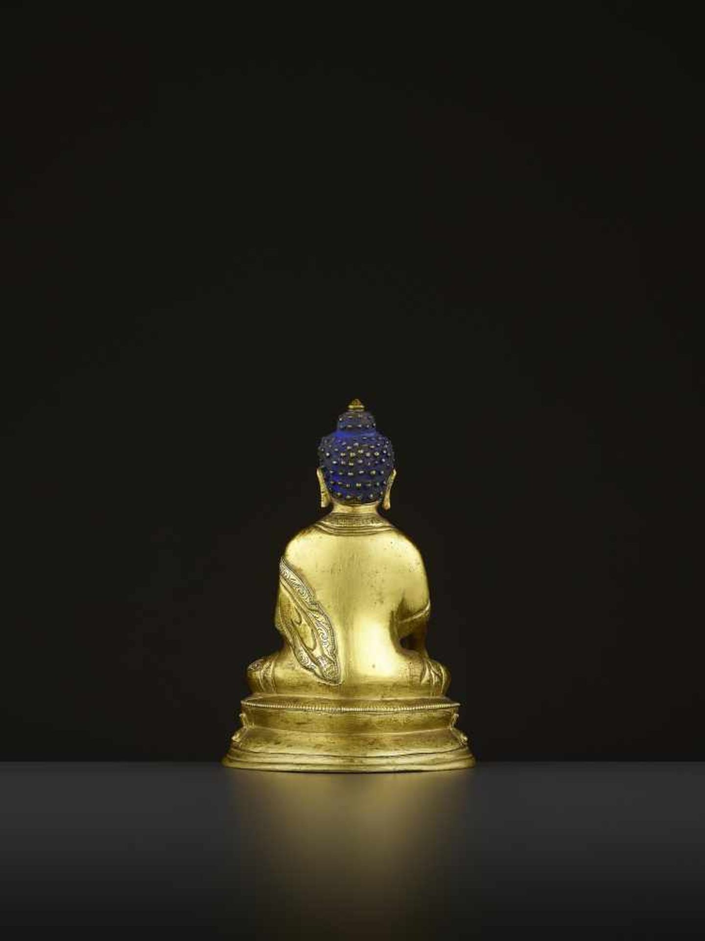 A GILT COPPER-ALLOY BUDDHA, QING China, 18th-19th century. The majestic deity is well cast seated in - Image 5 of 8