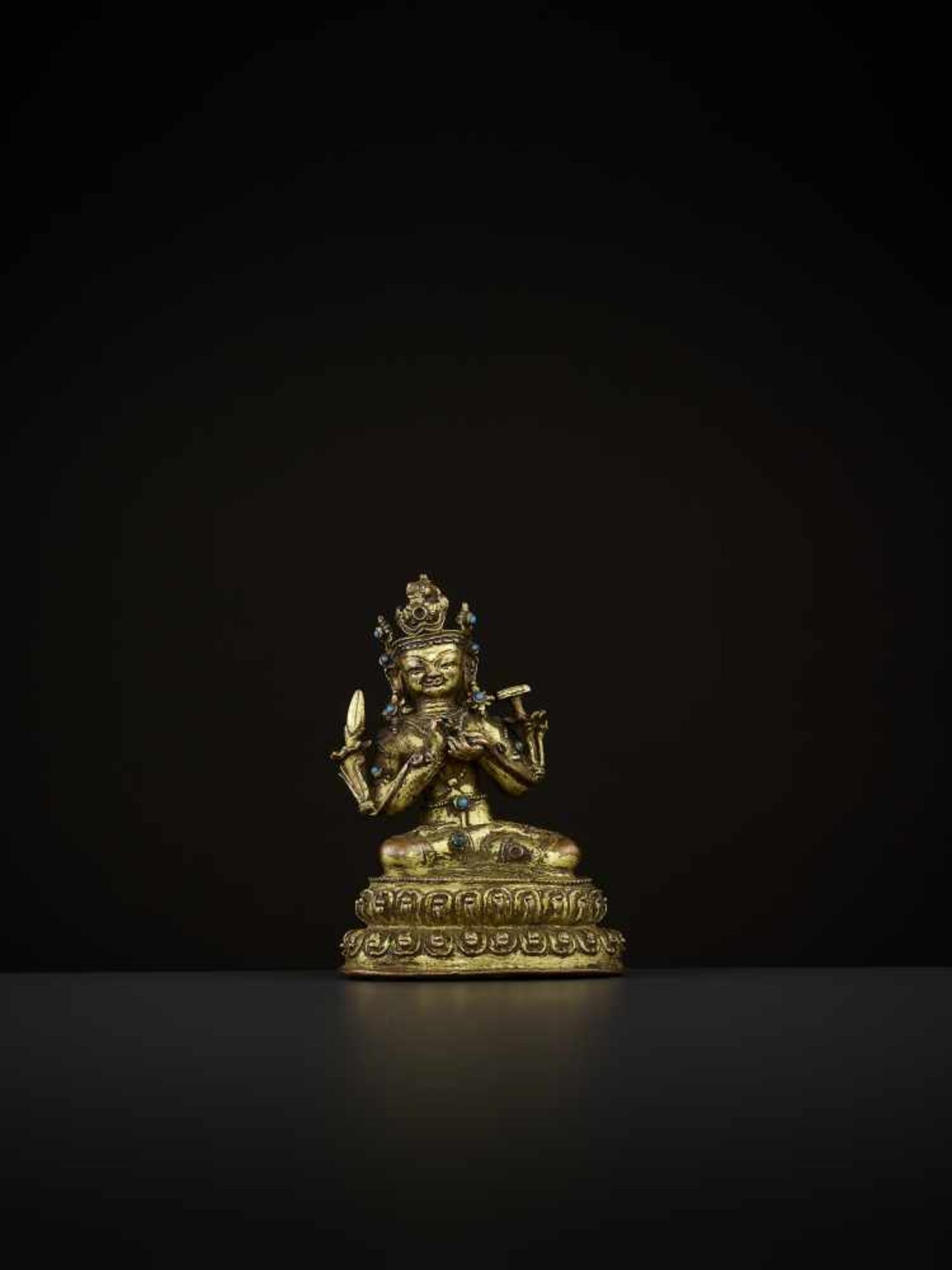 A GILT-BRONZE OF MANJUSHRI Tibet, 14th-15th century. The bodhisattva is seated in vajrasana on a - Image 7 of 9