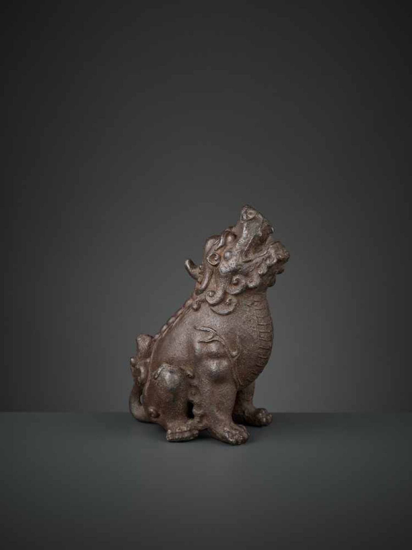A ROARING QILIN, EARLY MING DYNASTY China, 14th-15th century. The mythical beast well cast and