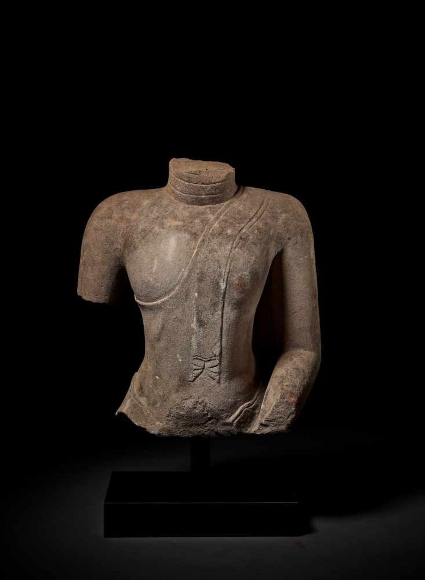 A LARGE SANDSTONE TORSO OF BUDDHA Thailand, Kingdom of Ayudhya, 15th – 16th century. Wearing a