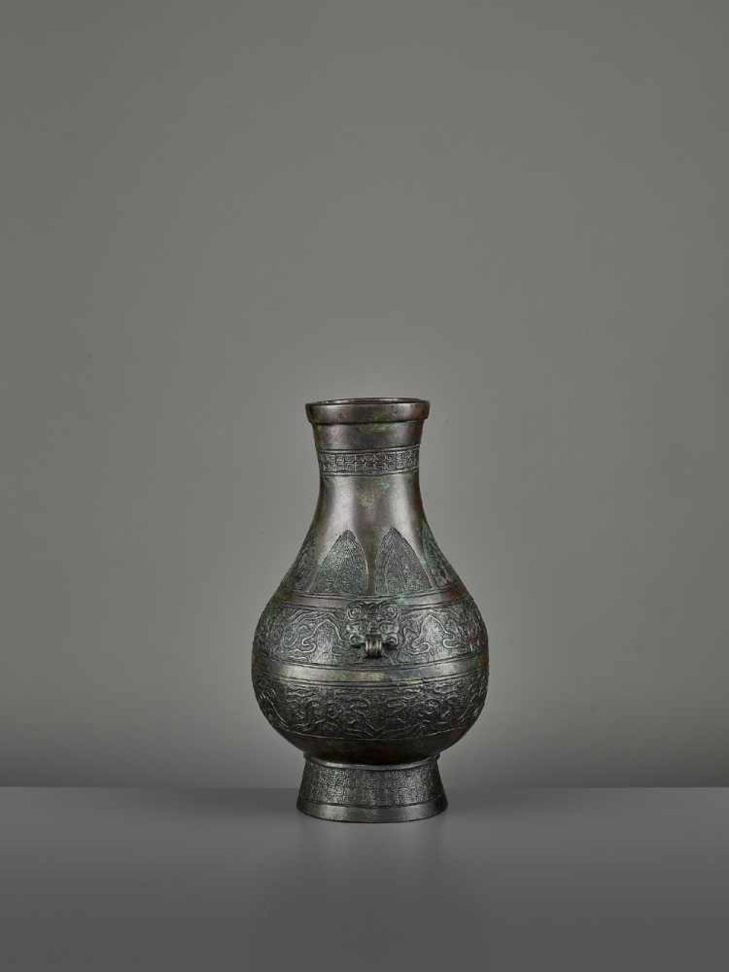 A BRONZE RITUAL VASE, HU China, Ming dynasty (1368-1644) or earlier. The archaistic vessel is cast - Image 7 of 11