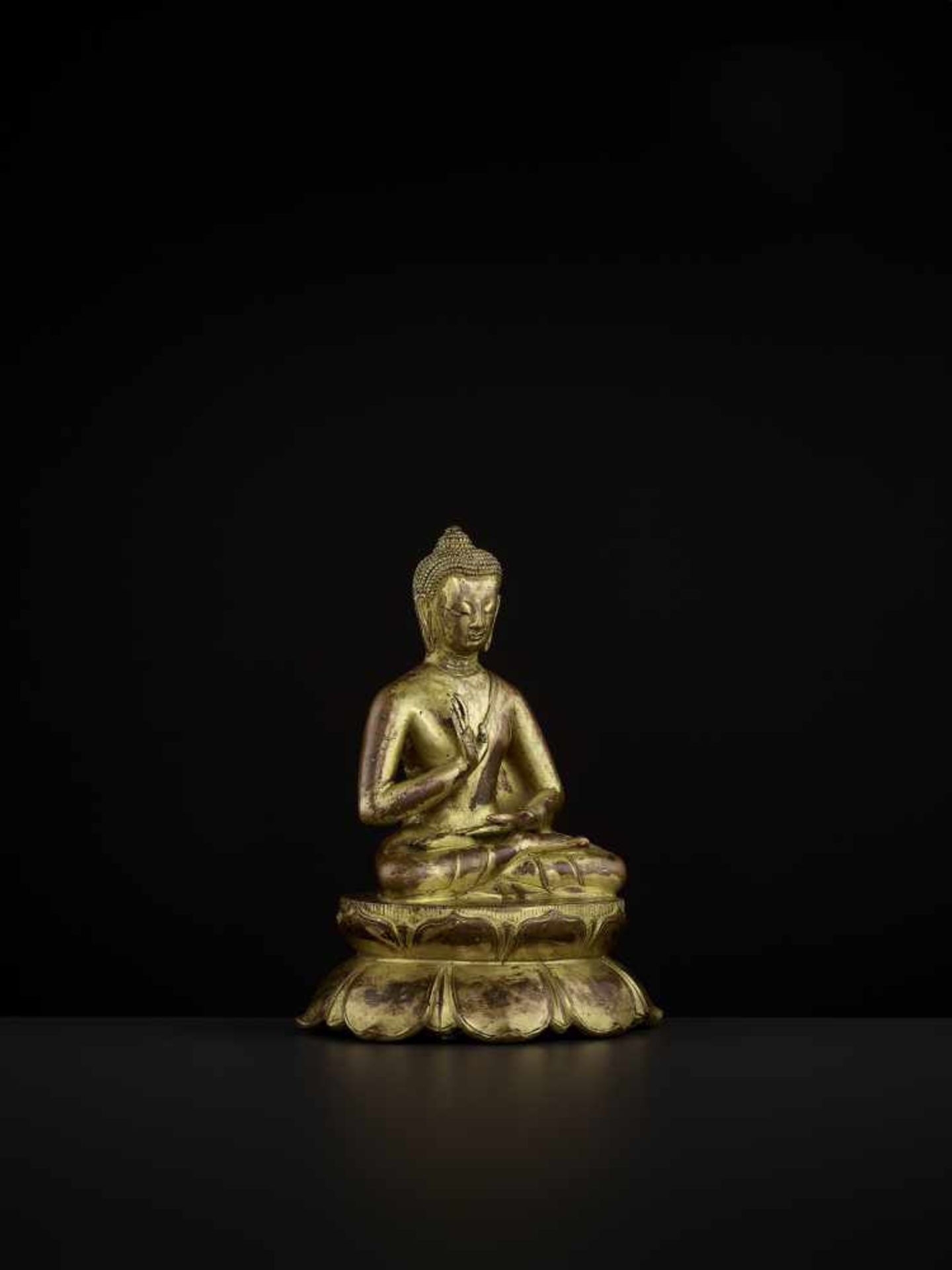 A BUDDHA AMOGHASIDDHI, NEPAL 17TH CENTURY The heavily cast gilt copper-alloy figure is seated in - Image 8 of 14