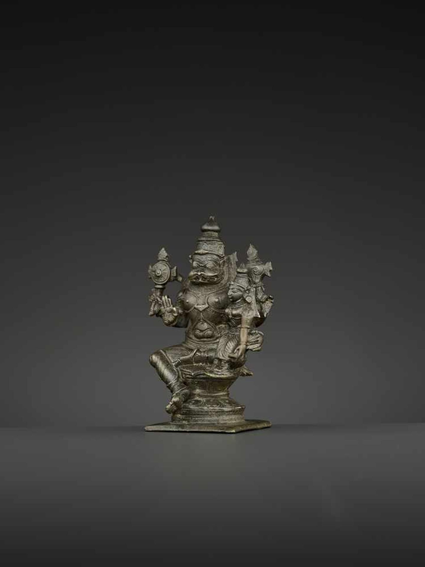 A NARASIMHA LAKSHMI BRONZE South India, Tamil Nadu, 18th – 19th century. The lion deity Narasimha is