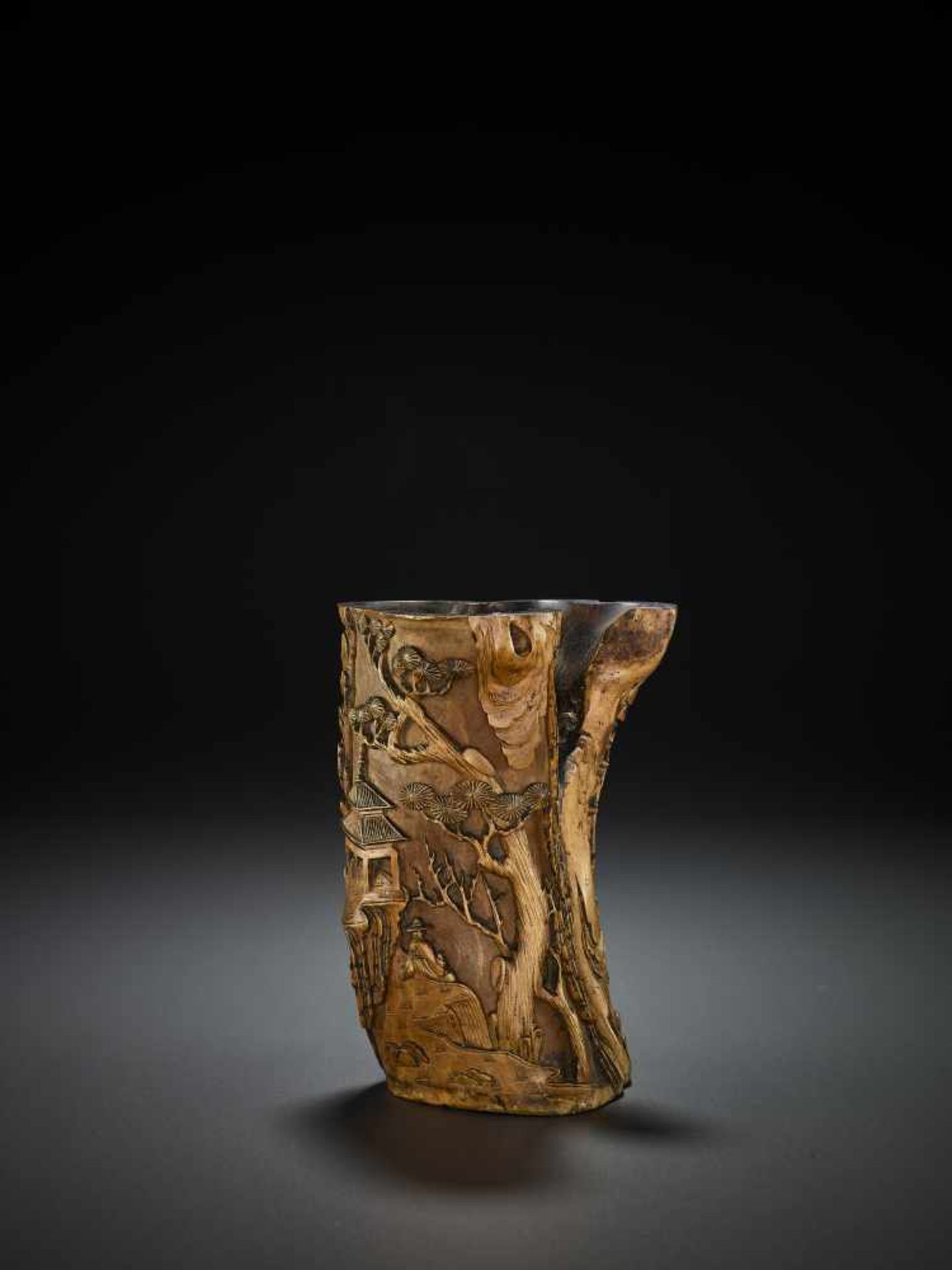 A CARVED WOOD BITONG, QING China, 18th – earlier 19th century. Several natural crevices are cleverly