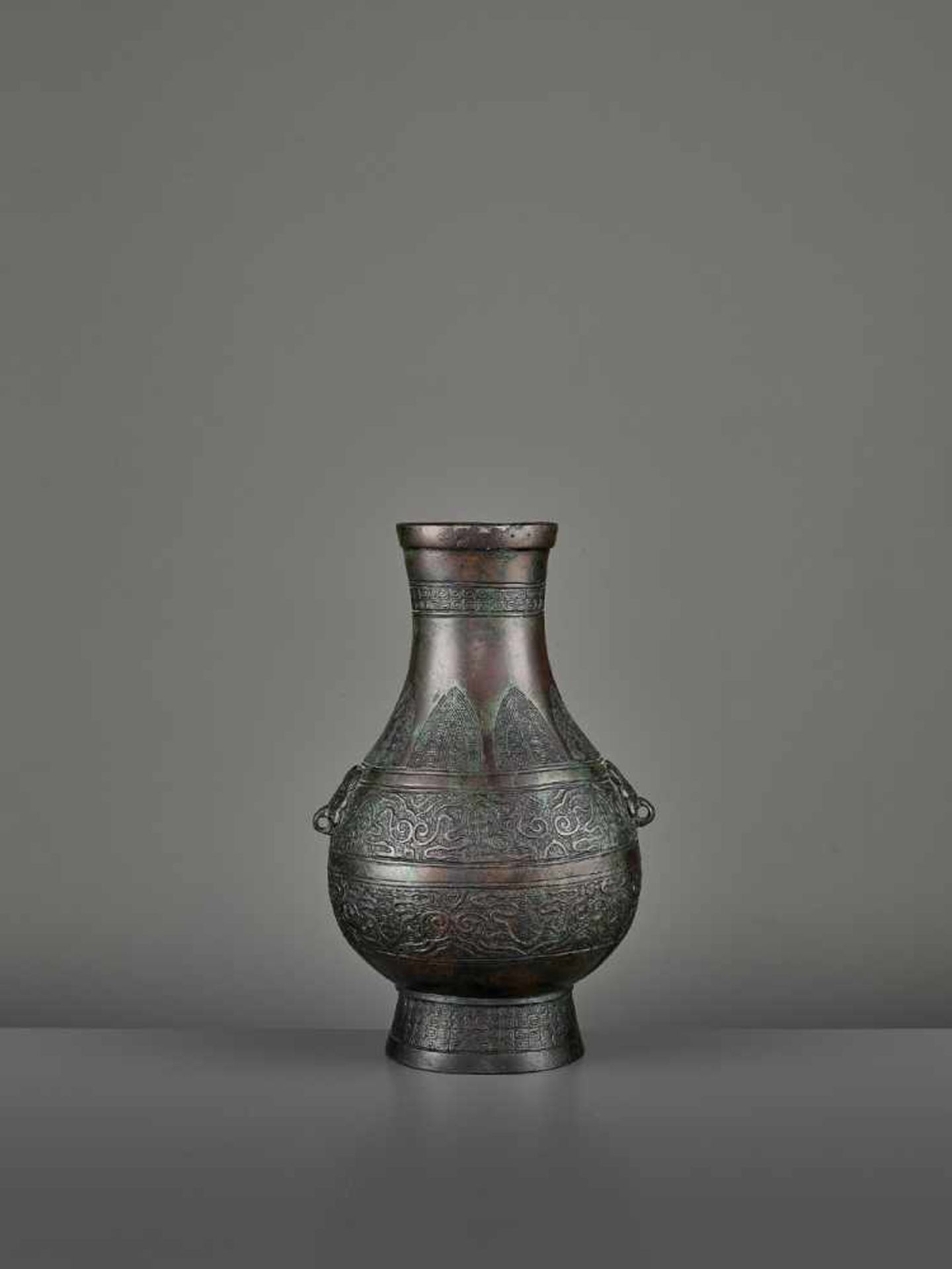 A BRONZE RITUAL VASE, HU China, Ming dynasty (1368-1644) or earlier. The archaistic vessel is cast - Image 2 of 11