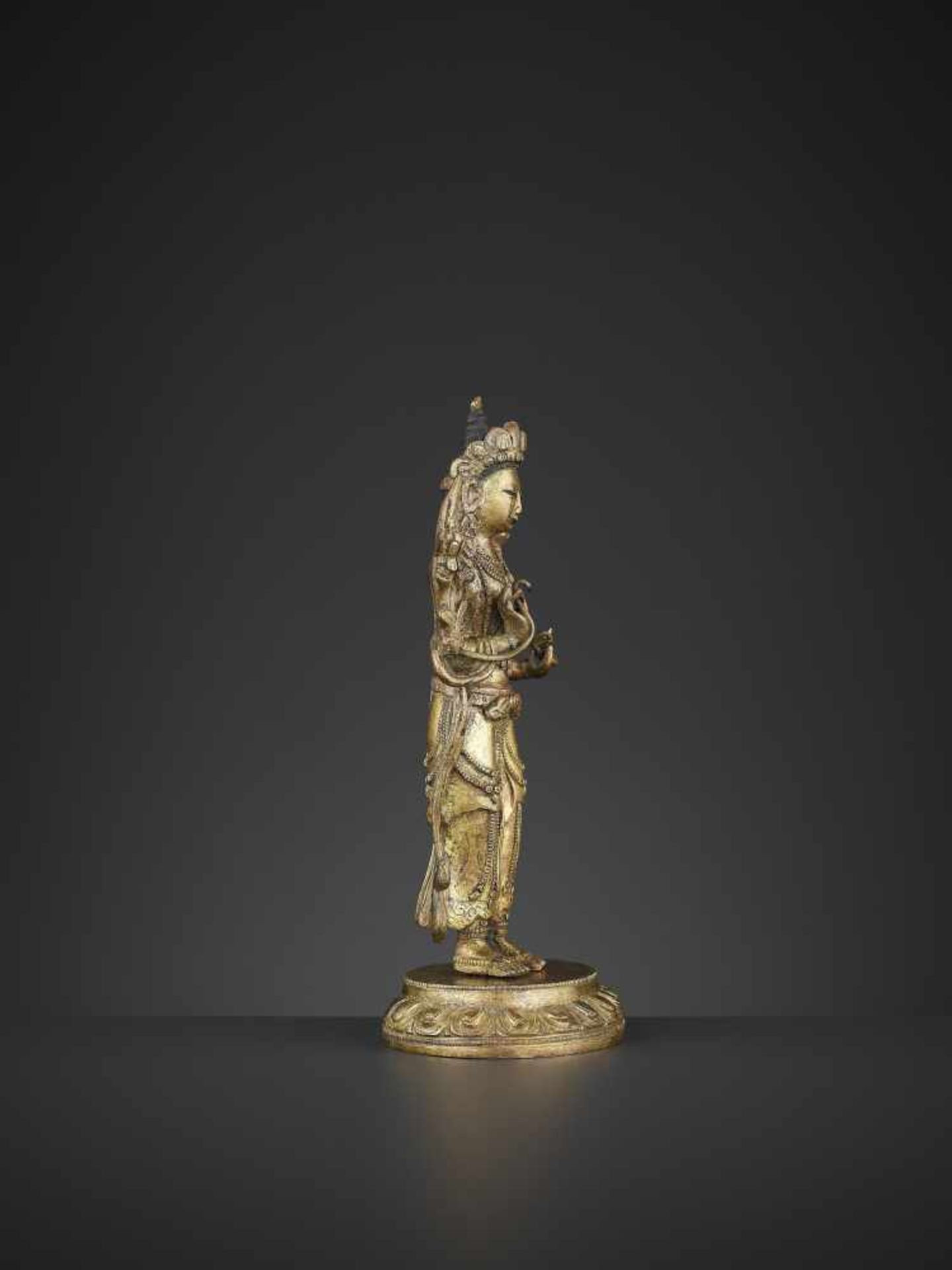 A GILT-BRONZE STANDING MANJUSHRI, QIANLONG China, 1736-1795. The proper right hand raised in vitarka - Image 5 of 10