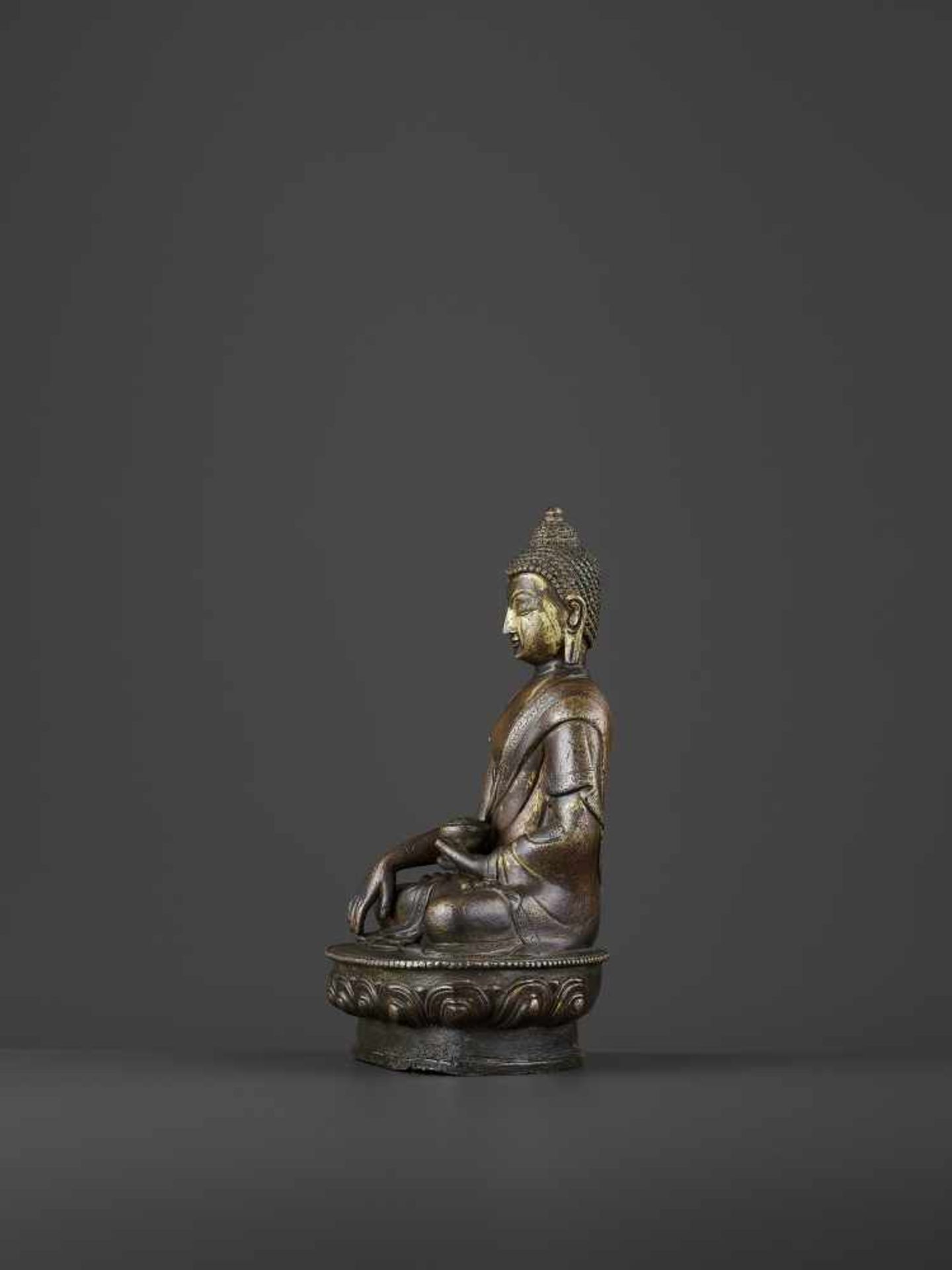 A BRONZE BUDDHA SHAKYMUNI, QING China, 18th century. The figure seated on a beaded lotus base in - Image 3 of 8