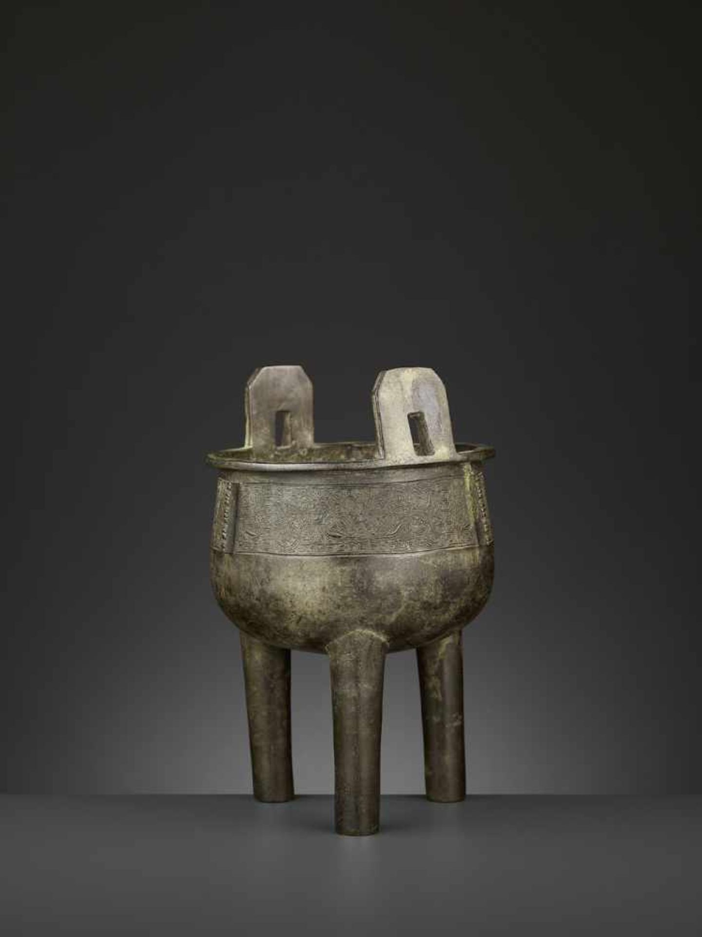 AN ARCHAISTIC BRONZE CENSER, DING China, 17th-18th century. The deep, bowl-shaped body supported - Image 8 of 10