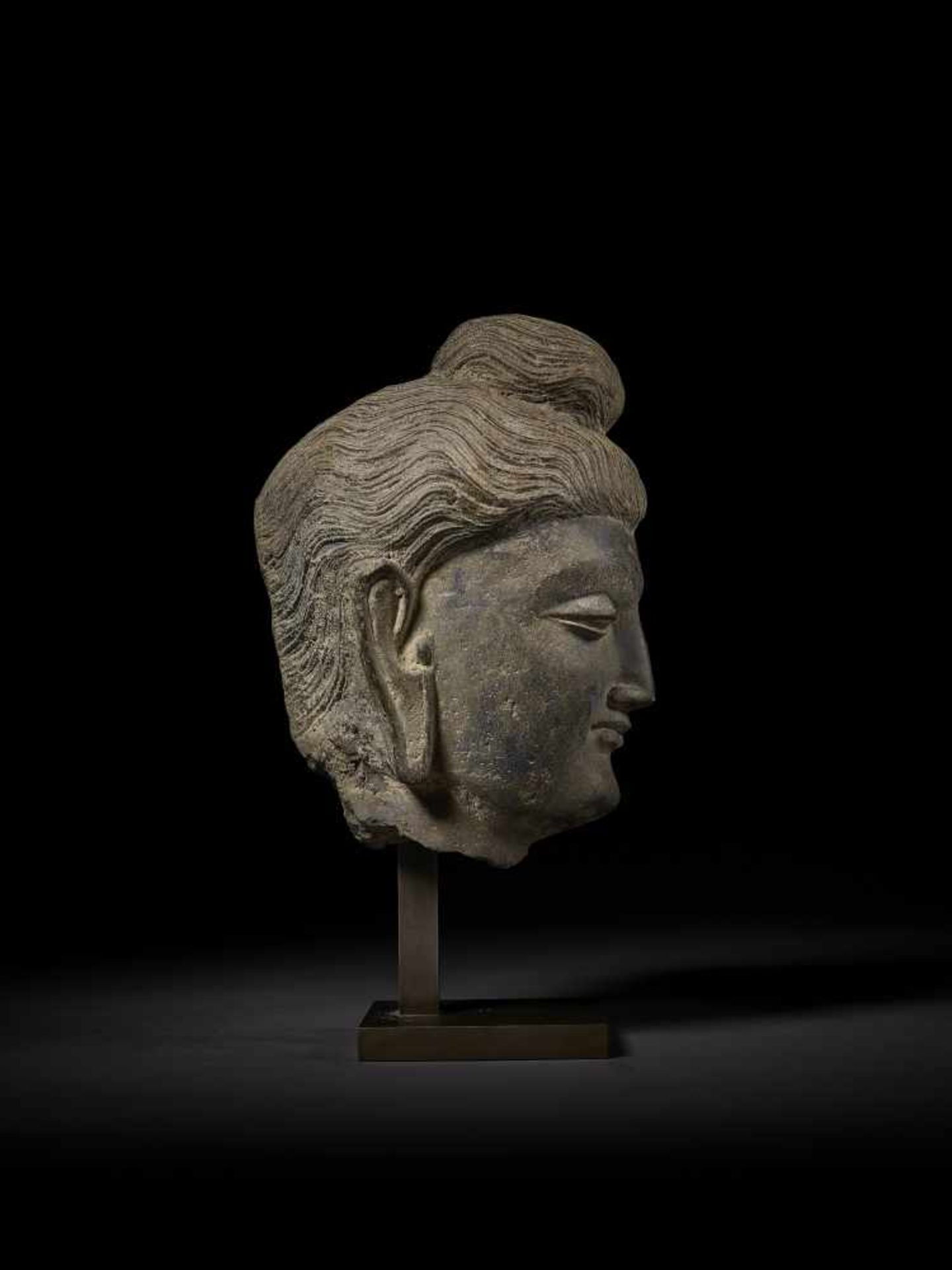 A LARGE HEAD OF BUDDHA, GANDHARA Ancient region of Gandhara, 3rd-4th century. Successfully evoking - Image 7 of 9