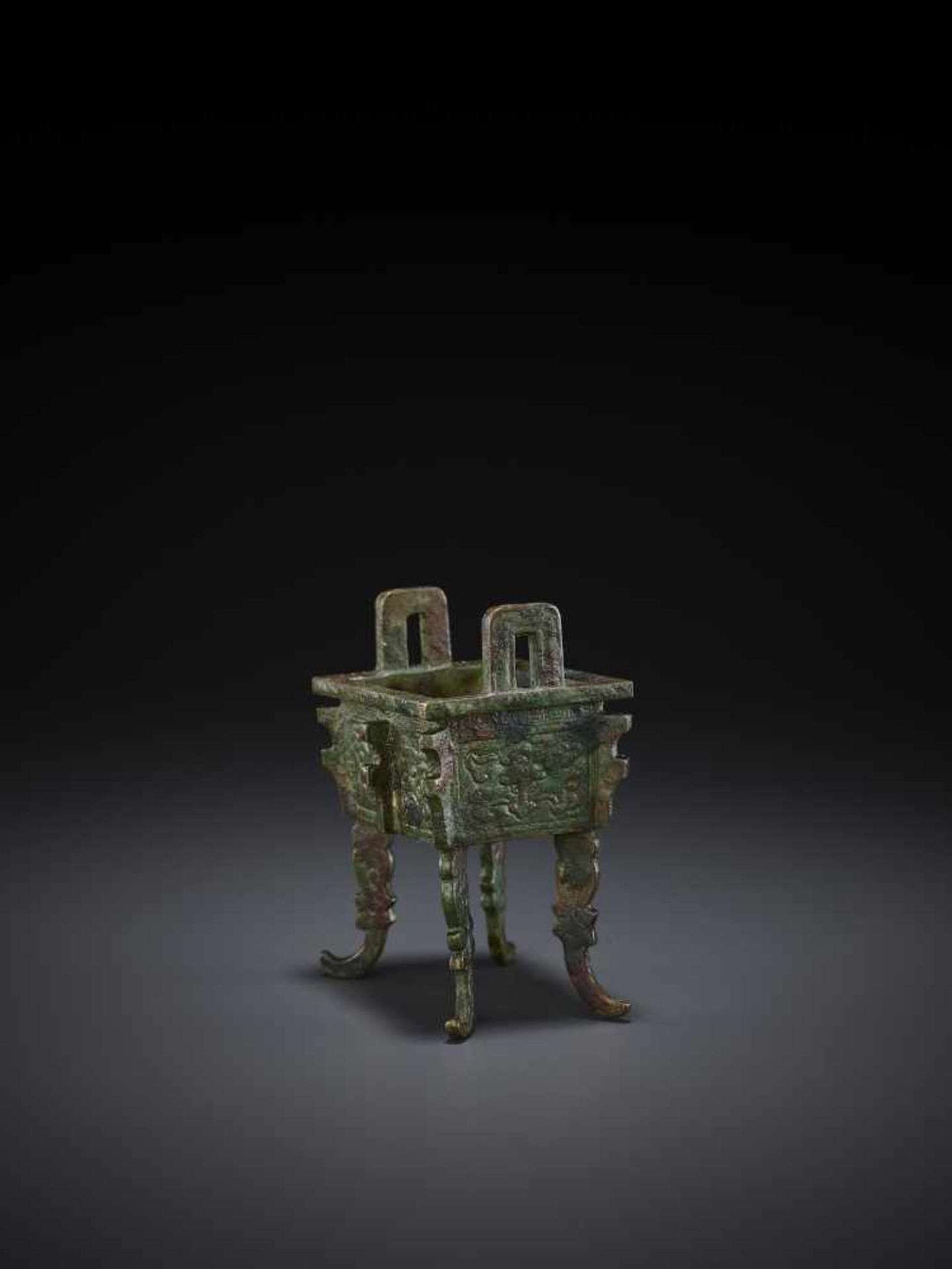 A MINIATURE BRONZE MODEL OF A FANGDING China, Qing dynasty. The miniaturized ritual food vessel - Image 5 of 10