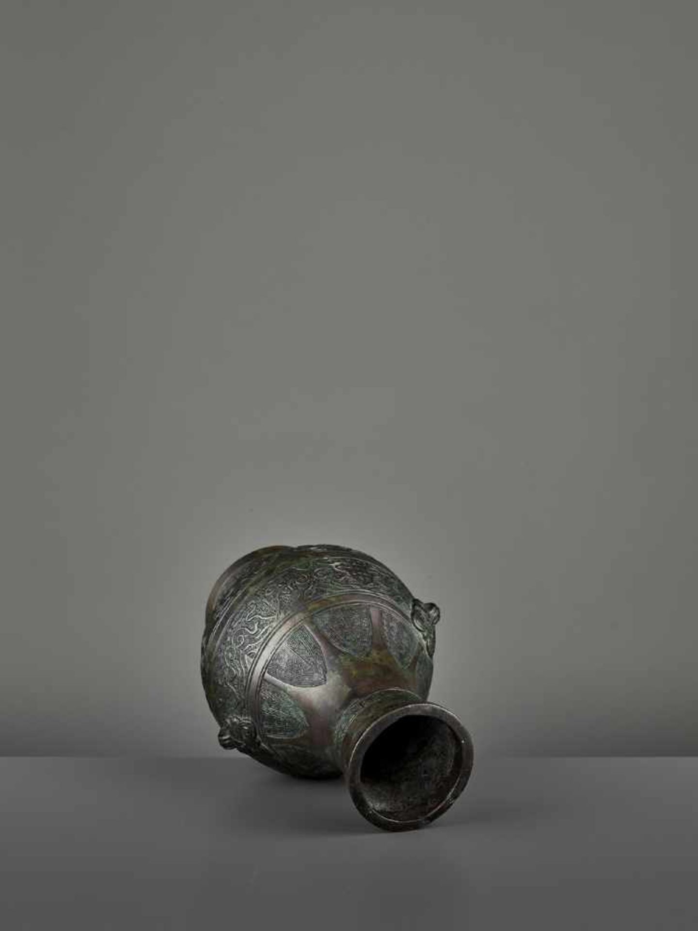 A BRONZE RITUAL VASE, HU China, Ming dynasty (1368-1644) or earlier. The archaistic vessel is cast - Image 9 of 11