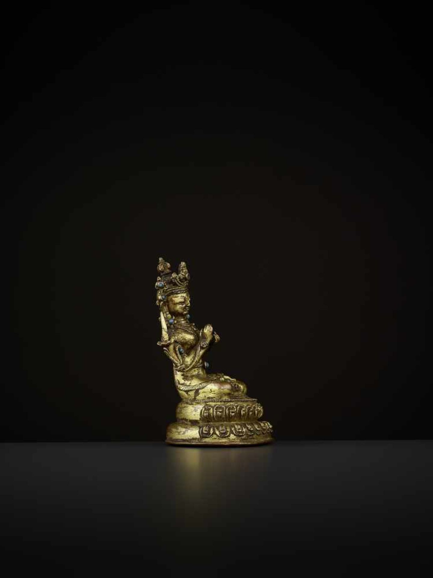 A GILT-BRONZE OF MANJUSHRI Tibet, 14th-15th century. The bodhisattva is seated in vajrasana on a - Image 5 of 9