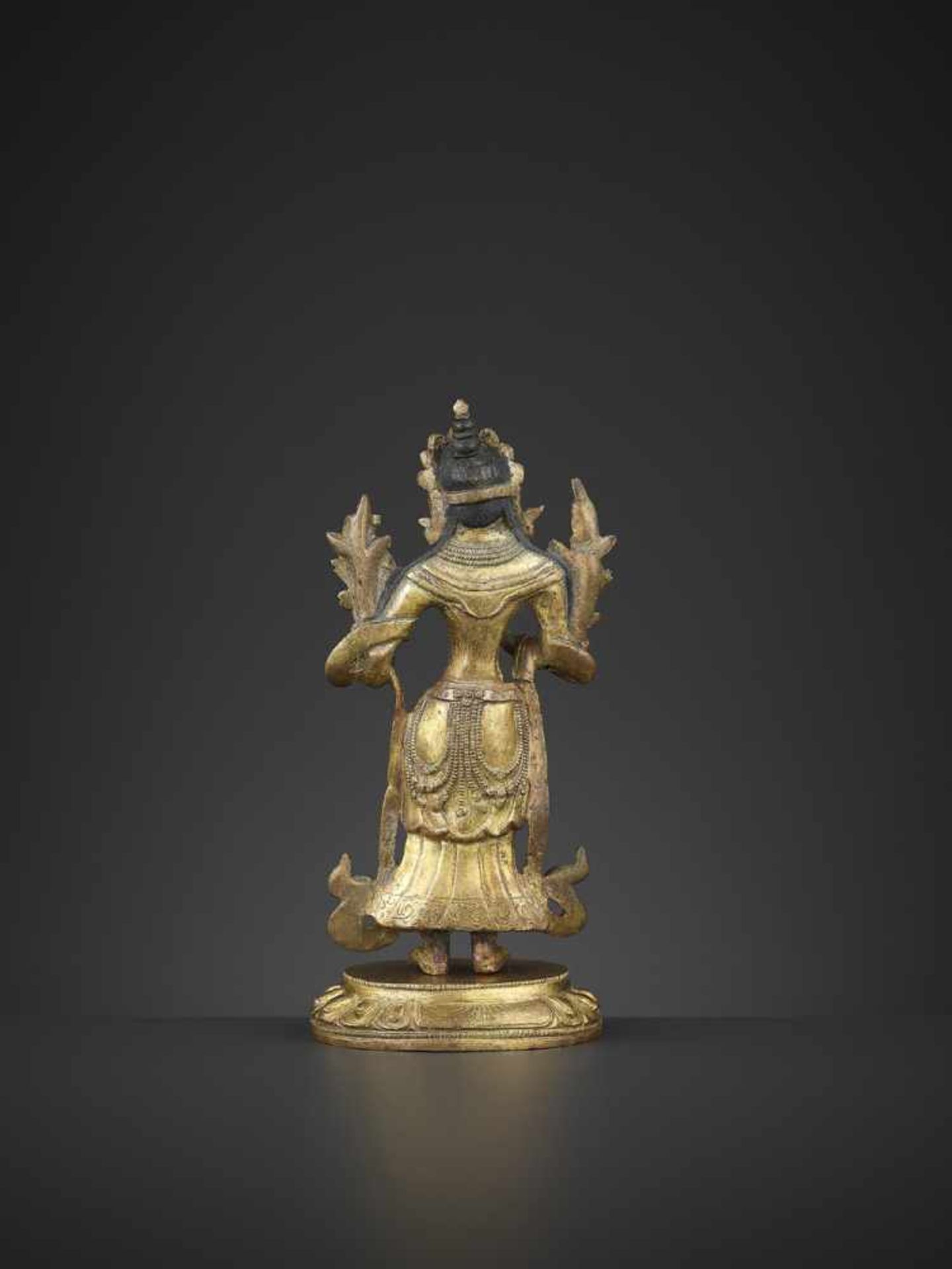 A GILT-BRONZE STANDING MANJUSHRI, QIANLONG China, 1736-1795. The proper right hand raised in vitarka - Image 4 of 10