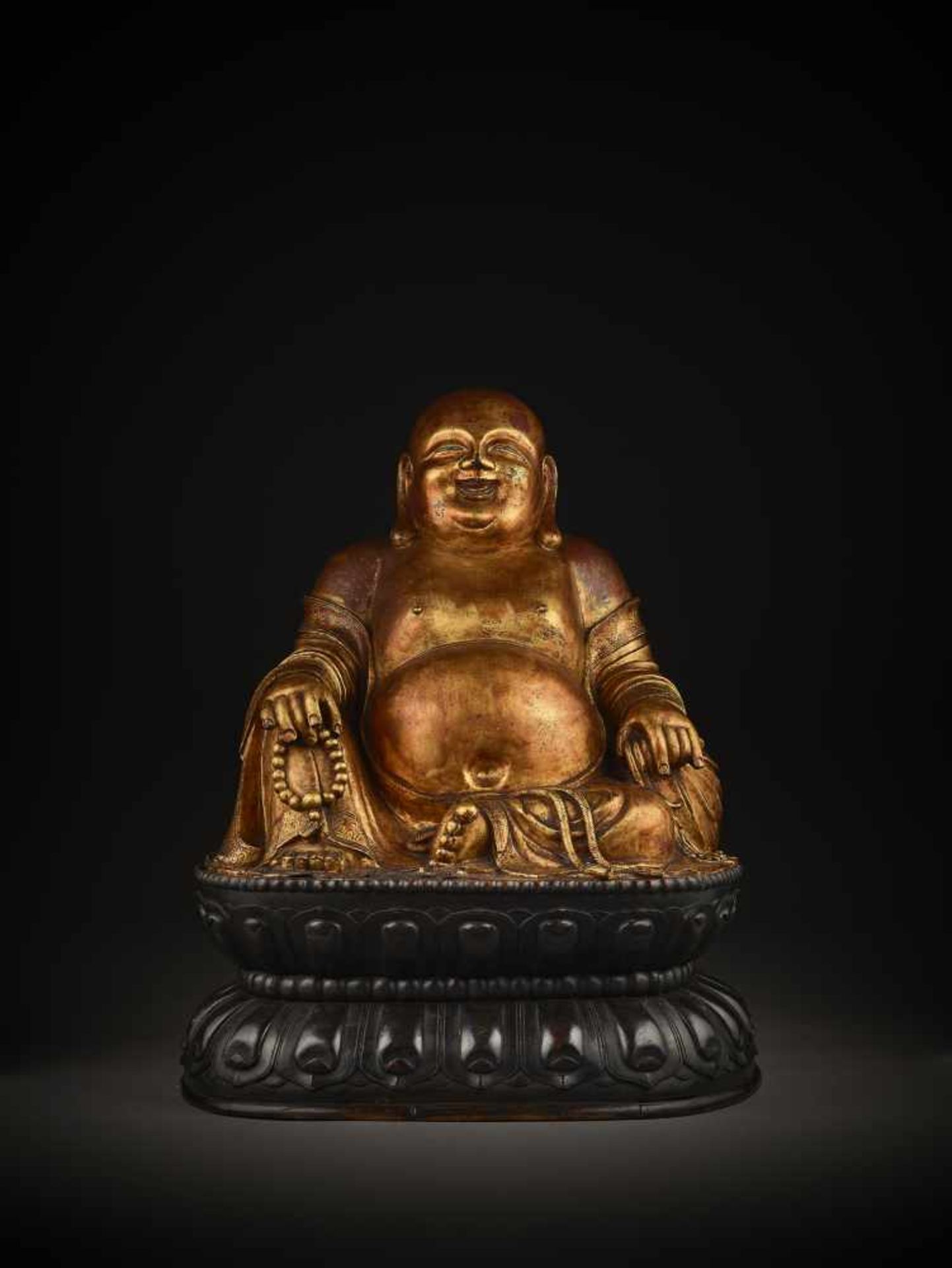 A LARGE GILT BRONZE FIGURE OF BUDAI China, 1368-1644. The smiling, corpulent figure is shown - Image 7 of 14