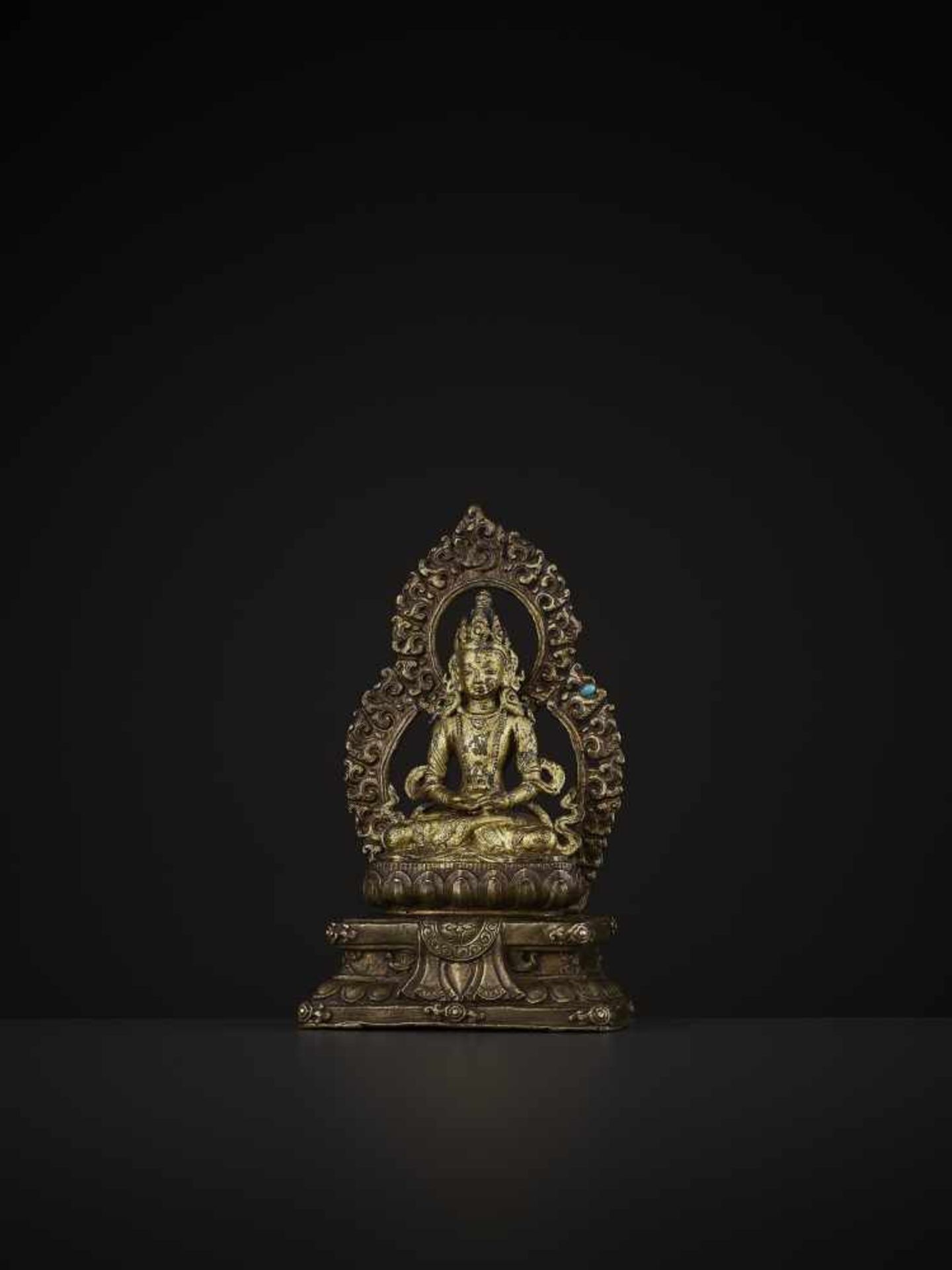 A COPPER ALLOY SHRINE TO AMITAYUS, QING China, 18th century. The lacquer gilt figure holding a